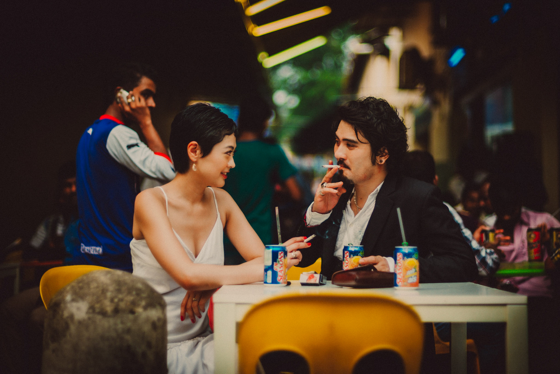 A Japanese couple enjoying a Sunday afternoon in an Indian food stall near Mustafa Centre, from Ibuki and Emi's candid chill engagement shoot in Little India, Singapore, October 2015, Leica M.