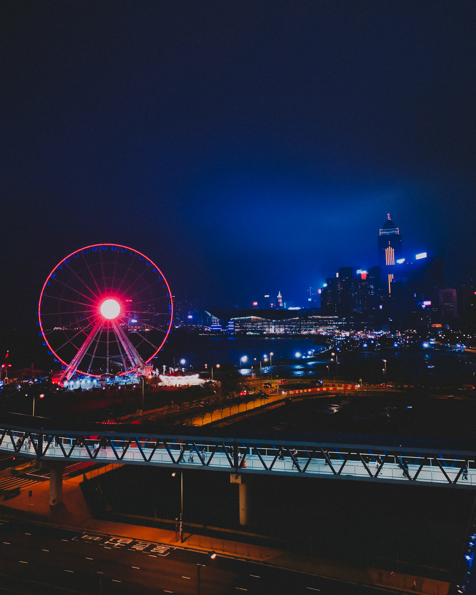 A cinematic photo of a ferris wheel and the Admiralty skyline, Central, Hong Kong, April 2019, Mate 20 Pro.