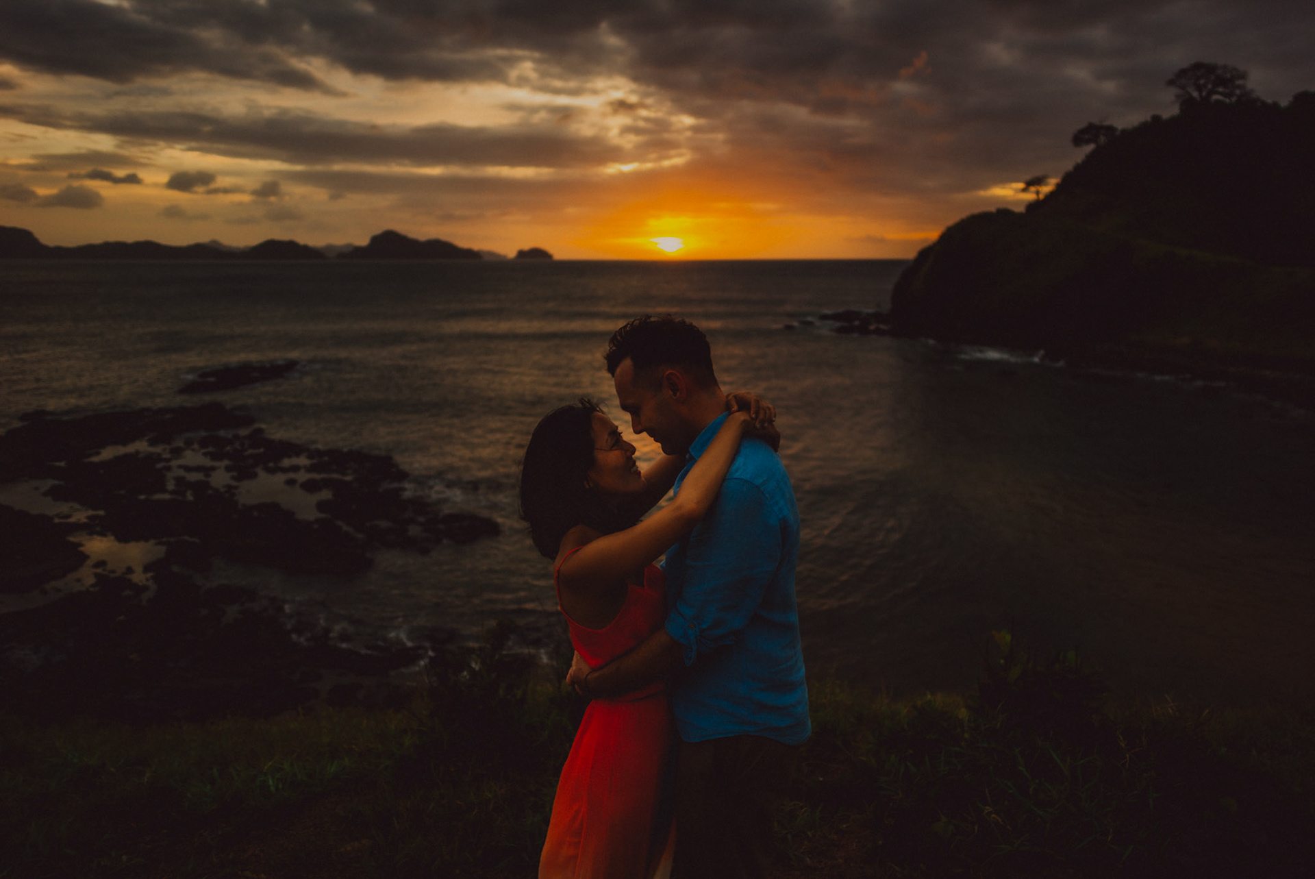 Moody sunset and blue hour couple portraits on a cliff overlooking El Nido Bay, Twin Beach beyond Nacpan, El Nido, Palawan, Philippines, Southeast Asia, January 2017, Leica M