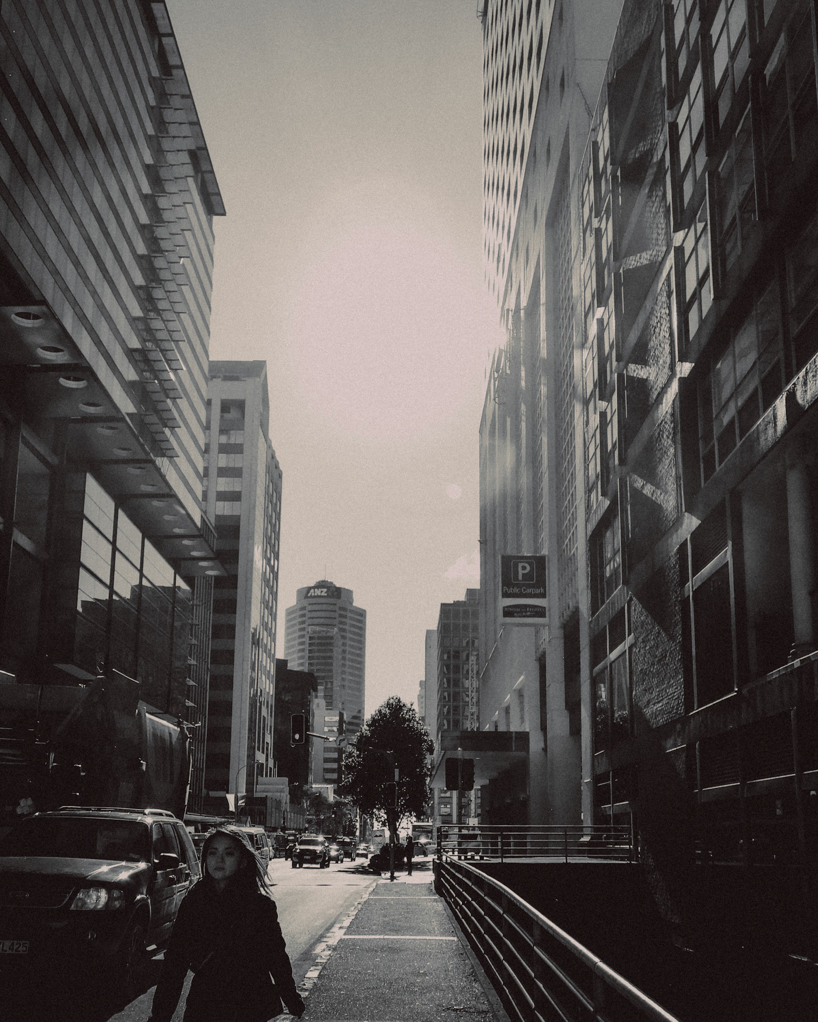 An Asian woman walking, downtown Auckland, New Zealand, June 2017, Huawei P10 Plus.