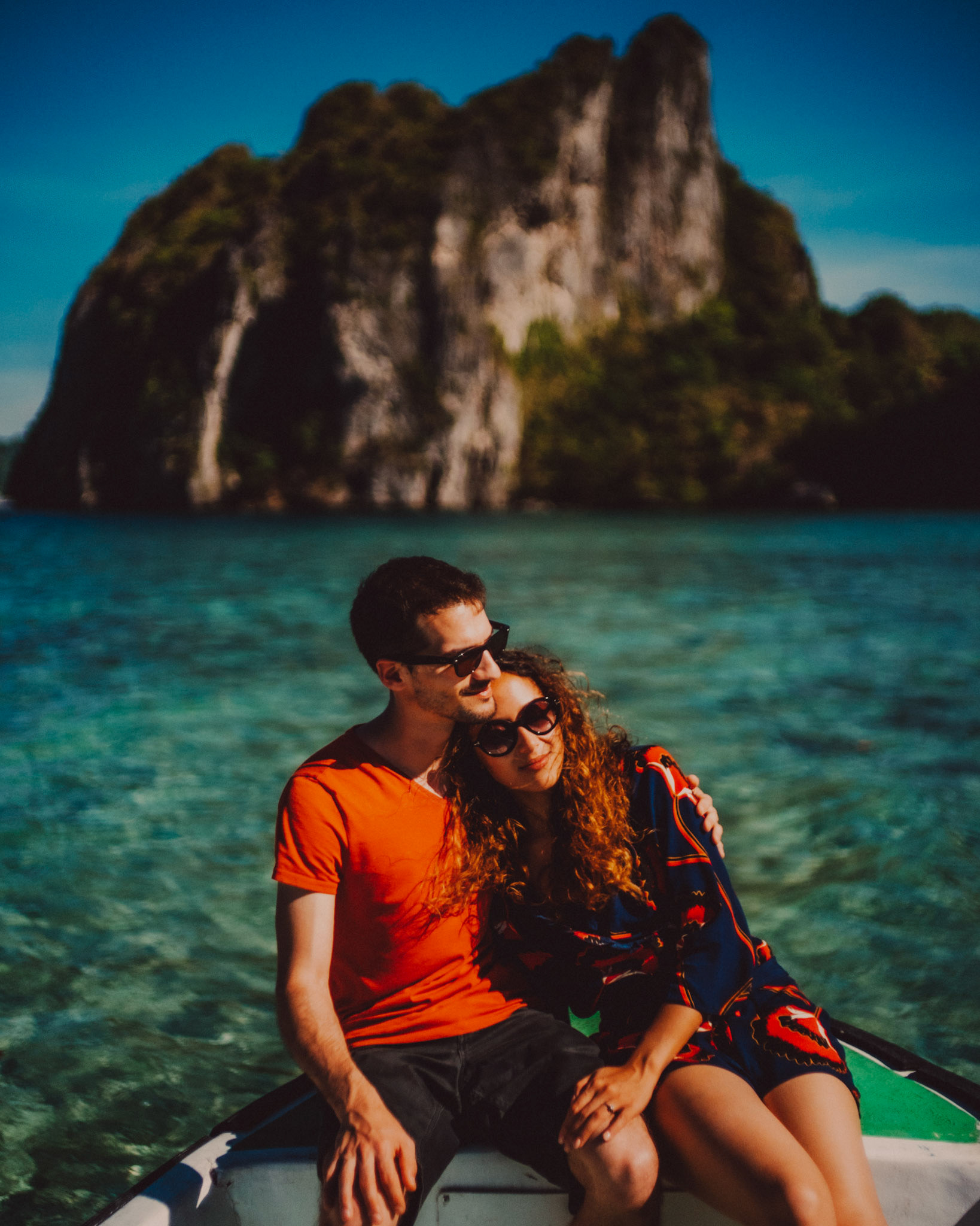 Couple portraits on a speedboat with turquoise blue water in the background, Cadlao Island, El Nido, Palawan, Philippines, Southeast Asia, April 2019, Sony A7III.