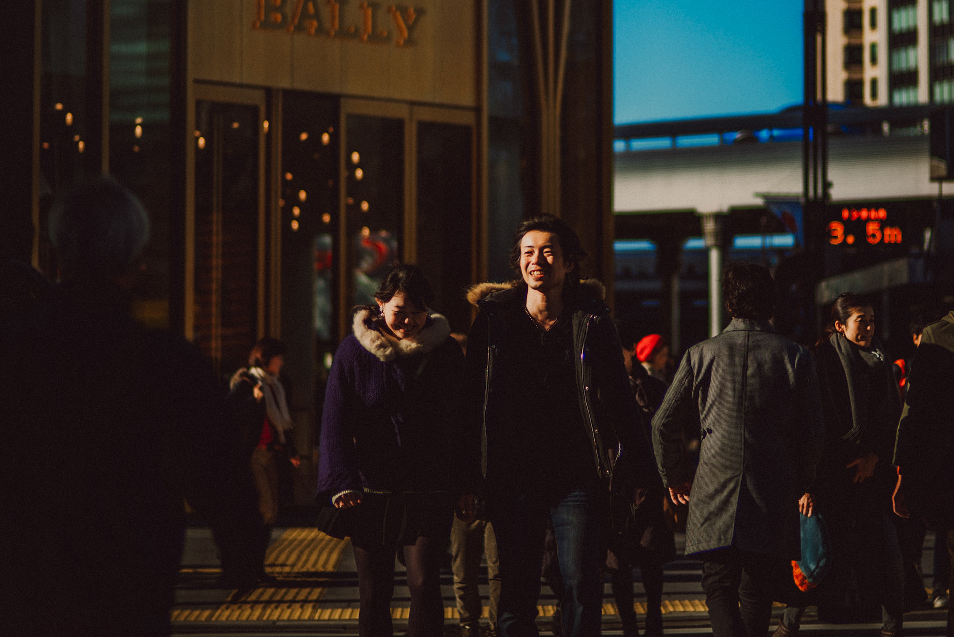 A Japanese couple among other pedestrians in Ginza, Tokyo, Japan, December 2016, Leica M.