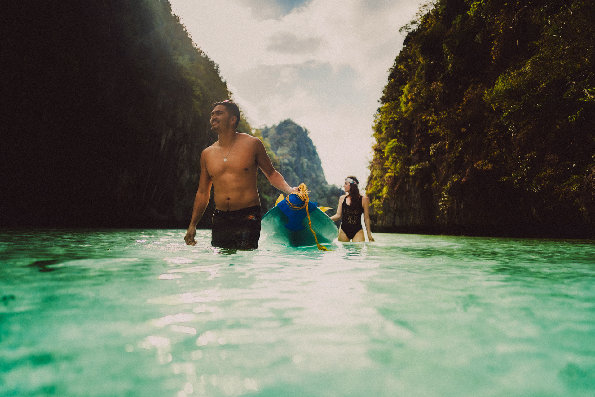 The couple wading waist-deep water in the Big Lagoon, from Peter &amp; Alexis' adventure engagement session in Miniloc Island, El Nido, Palawan, Philippines, Southeast Asia, April 2018, Sony A7SII