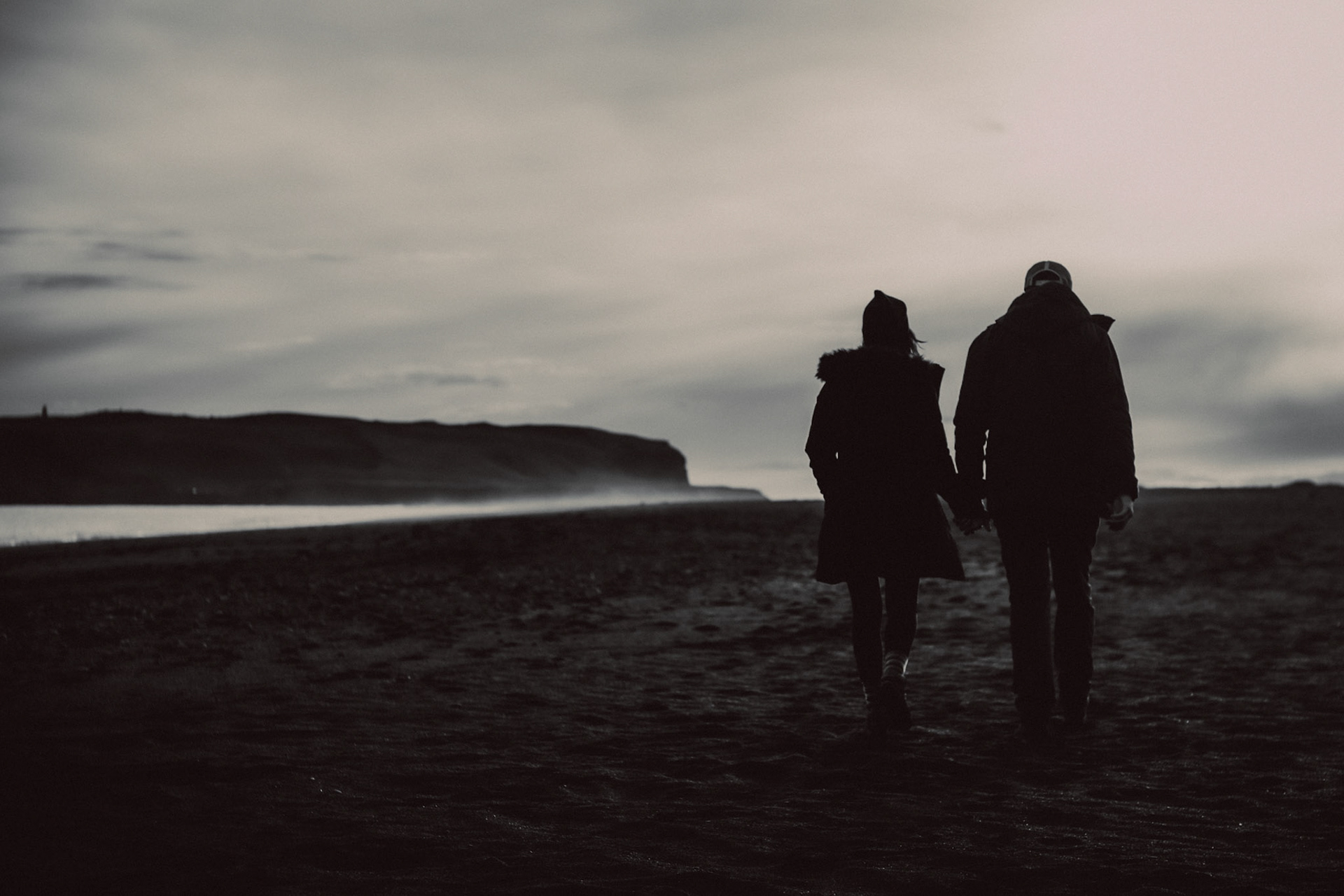 Sam &amp; Brooke, black and white adventure engagement portraits at the Reynisfjara black sand beach, Iceland, May 2016, Sony A7RII.