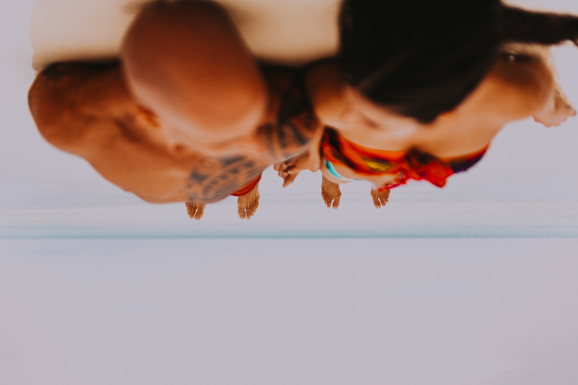 Creative couple portraits at White Beach Station 1, upside down in front of Discovery Shores, Boracay, Philippines, Southeast Asia, December 2018, Sony A7III.