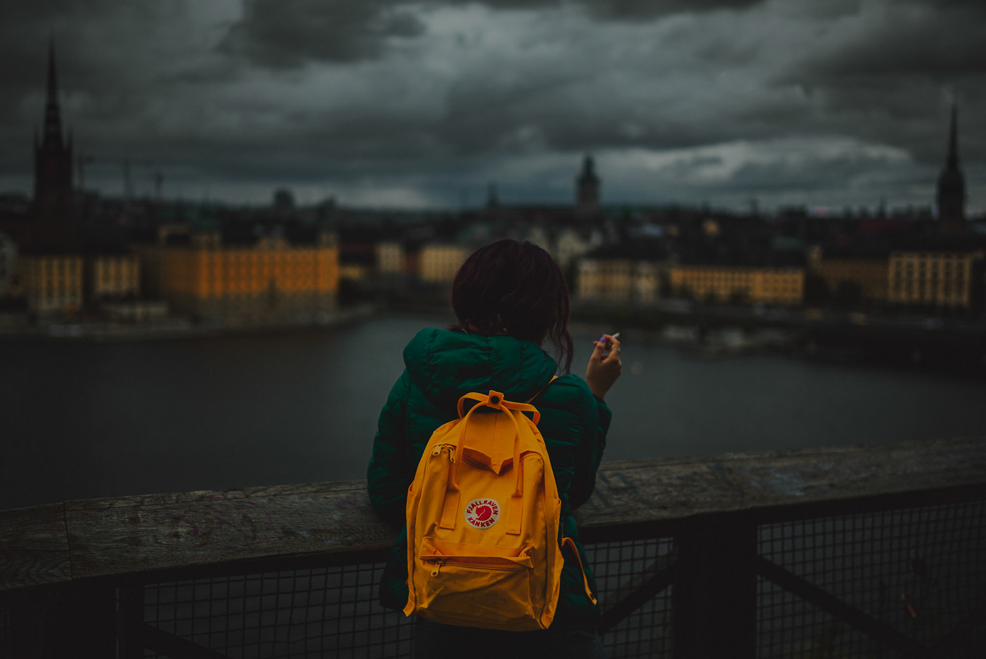 A girl with colored hair wearing a yellow Fjallraven Kanken backpack and the city view from Mariaberget, Stockholm, Sweden, July 2016, Leica M.