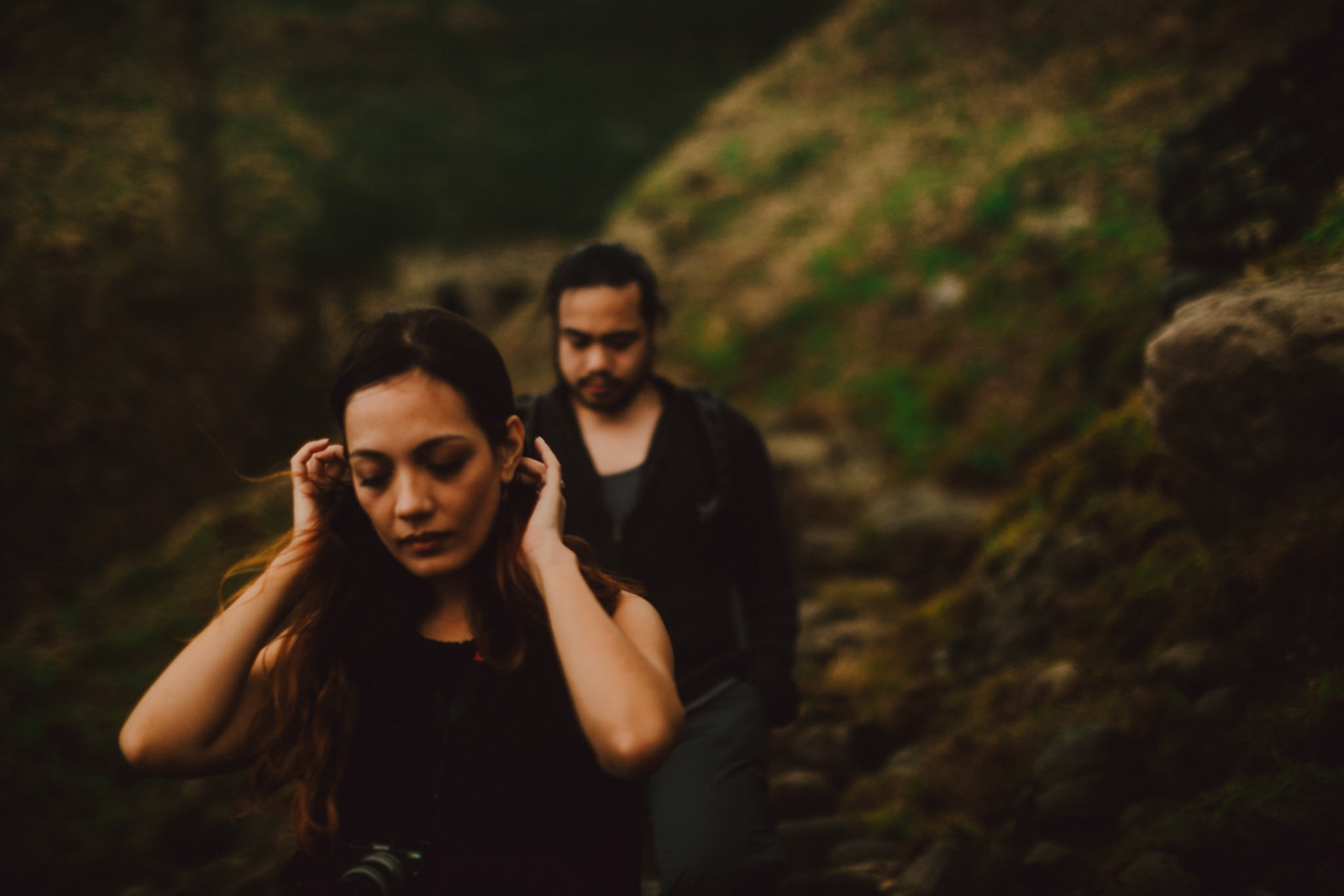 Moody backpacker couple portraits on a rocky cliff below Chawa View Deck in Mahatao, Batanes, Philippines, Southeast Asia, November 2014, Canon EOS 6D.