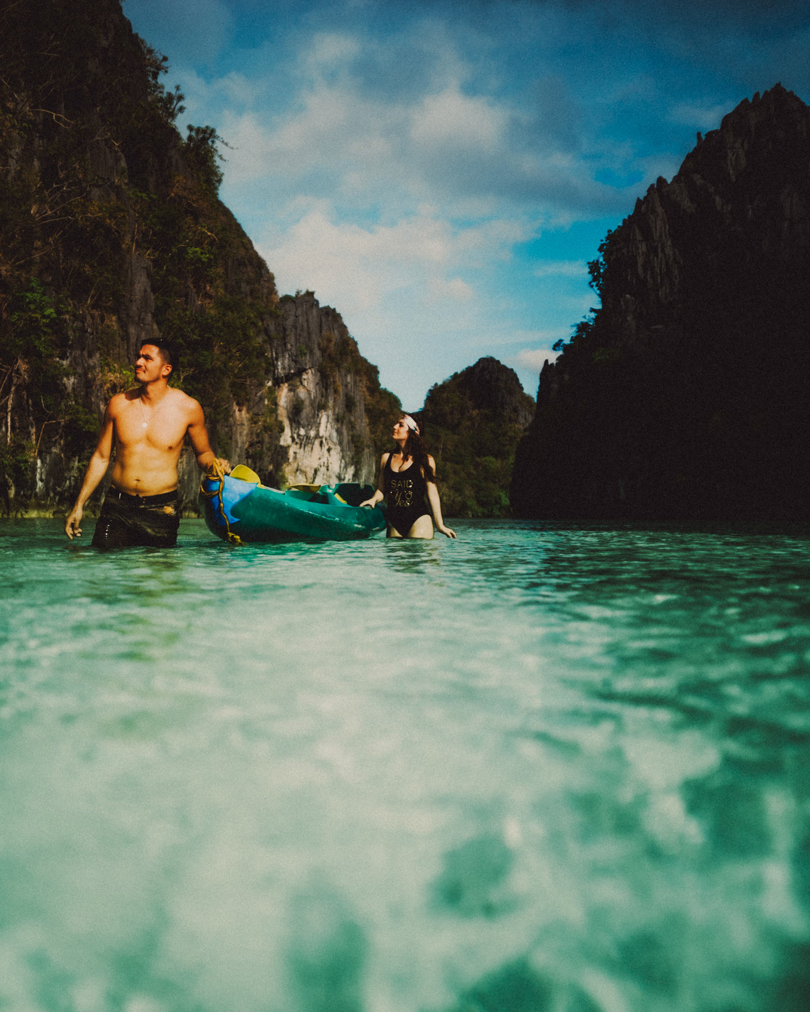 The couple wading waist-deep water in the Big Lagoon, from Peter &amp; Alexis' adventure engagement session in Miniloc Island, El Nido, Palawan, Philippines, Southeast Asia, April 2018, Sony A7SII