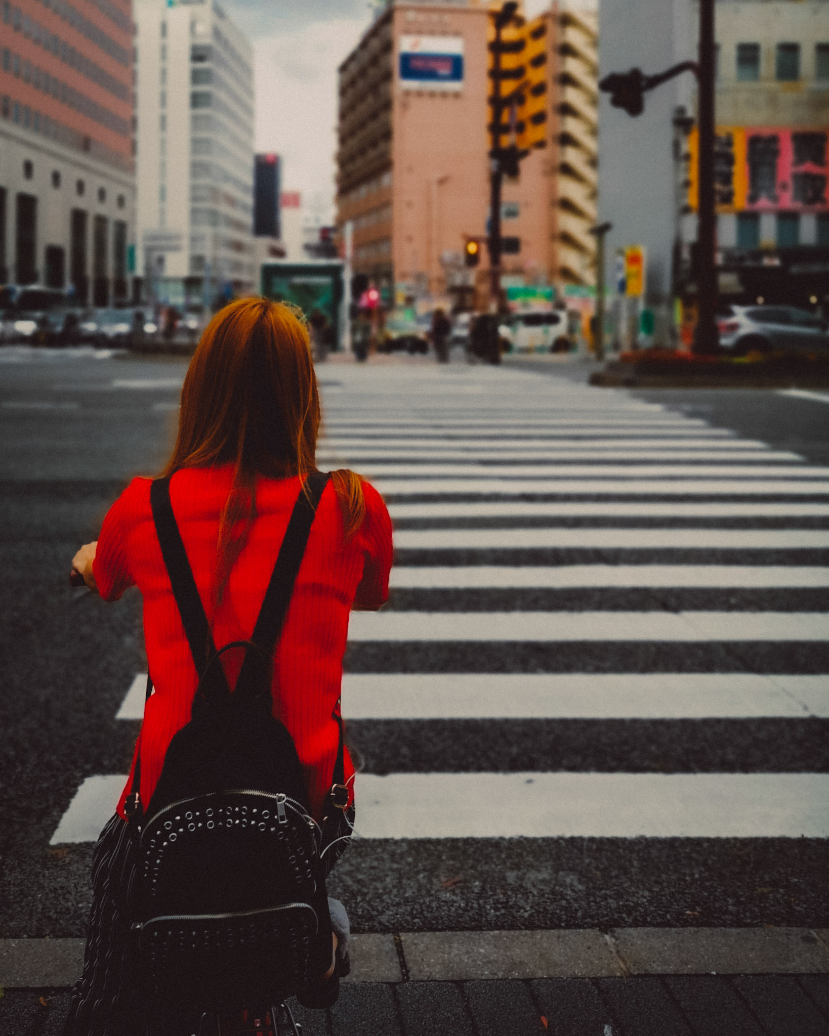 A Japanse girl wearing a red shirt in Tenjin, Fukuoka, Japan, October 2018, Huawei P20 Pro.