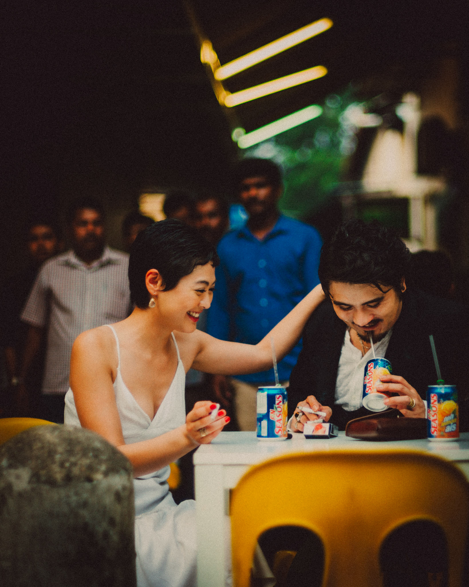 A Japanese couple enjoying a Sunday afternoon in an Indian food stall near Mustafa Centre, from Ibuki and Emi's candid chill engagement shoot in Little India, Singapore, October 2015, Leica M.
