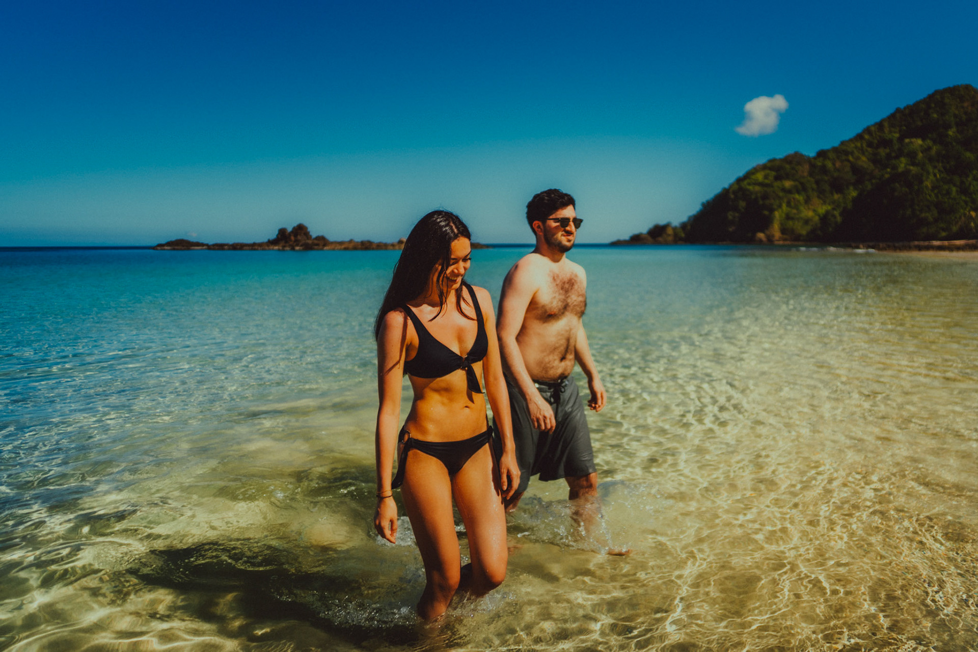 Wading through clear, waist-deep water on a tropical beach in Cadlao Island, El Nido, Palawan, Philippines, Southeast Asia, March 2020, Sony A7III.