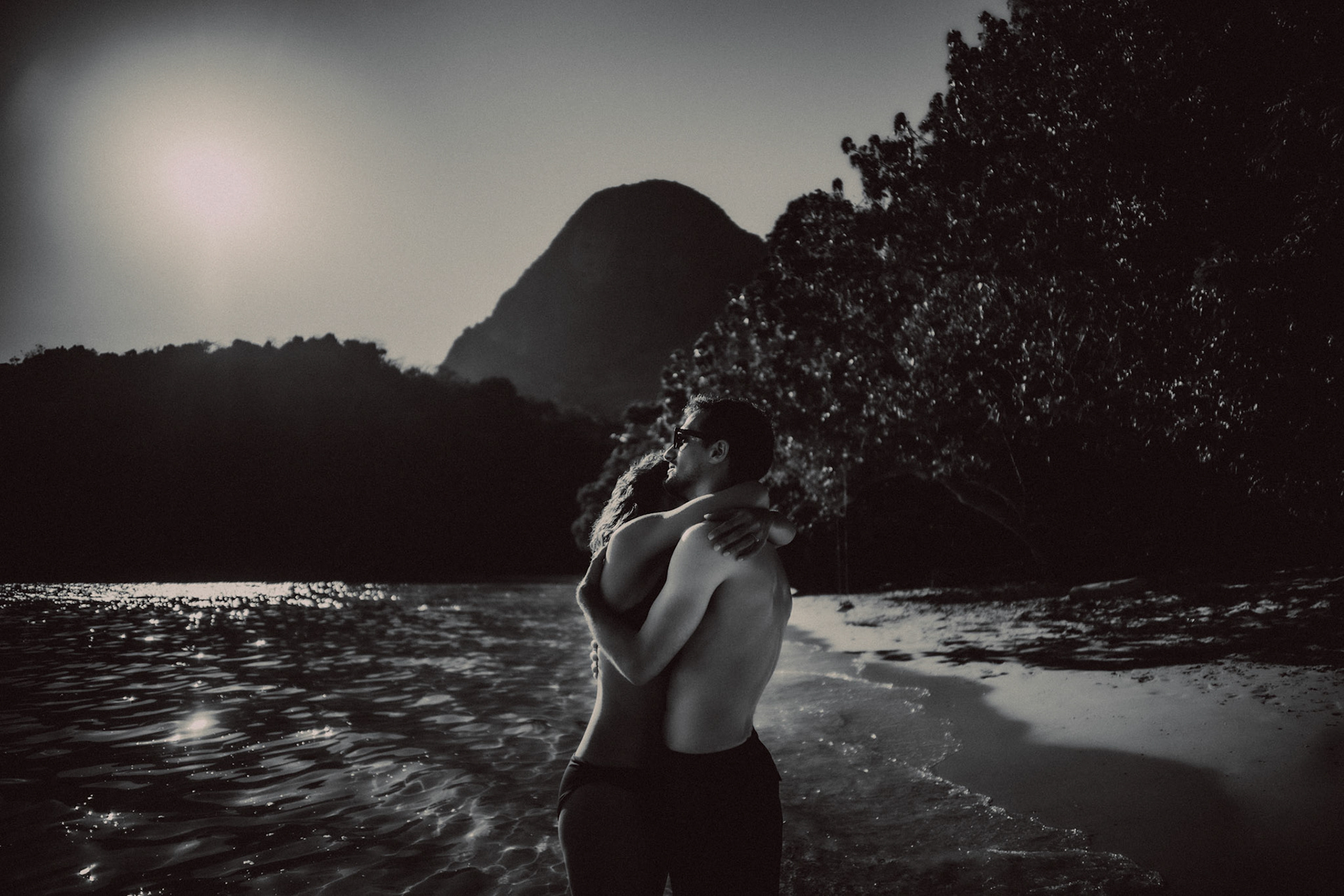 Moody black and white couple portraits in Paradise Beach, Cadlao Island, El Nido, Palawan, Philippines, Southeast Asia, April 2019, Sony A7III.