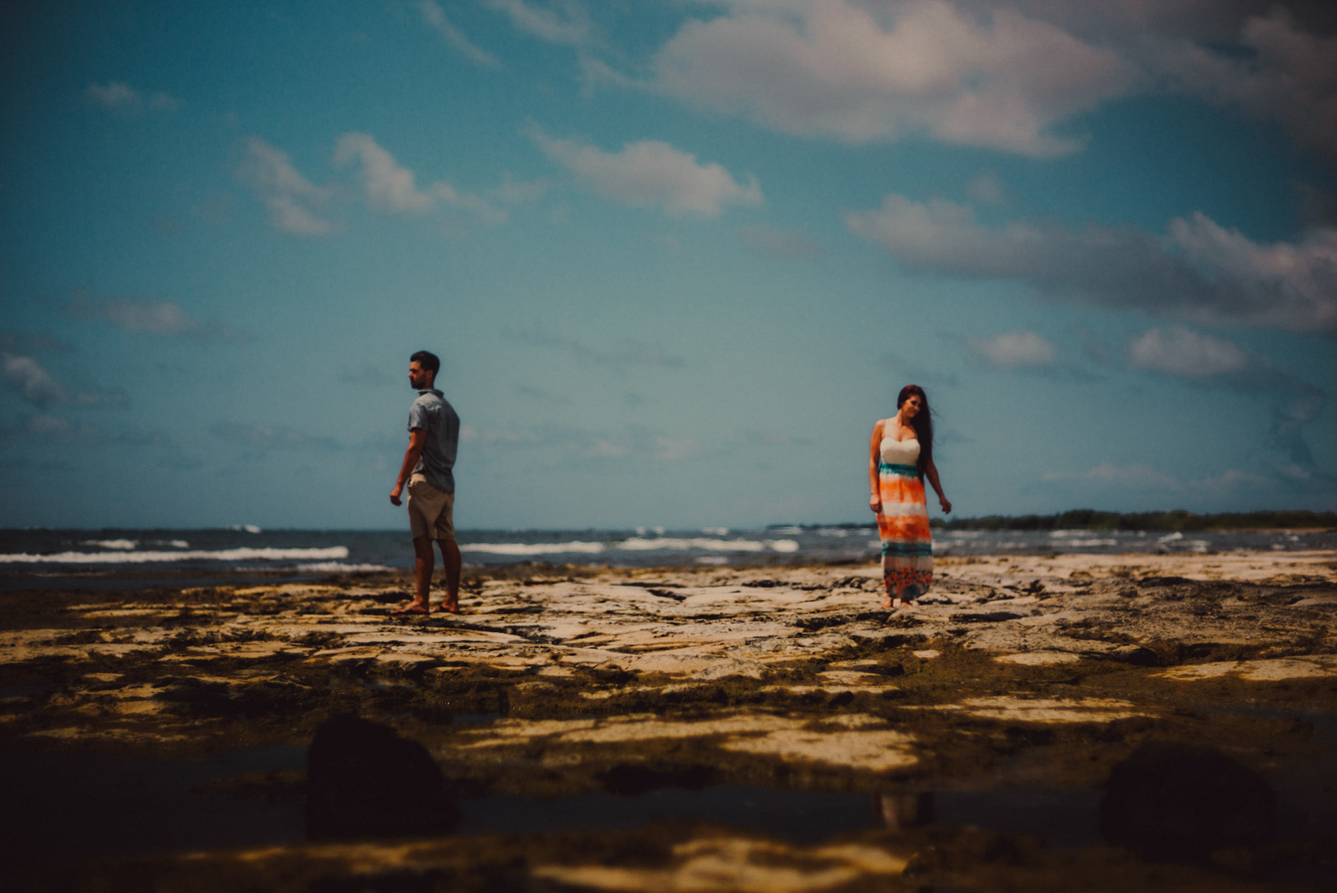 Couple portraits on a rocky beach, from Ryan and Angela's engagement session in Hawaii, USA, September 2015, Sony A7S.