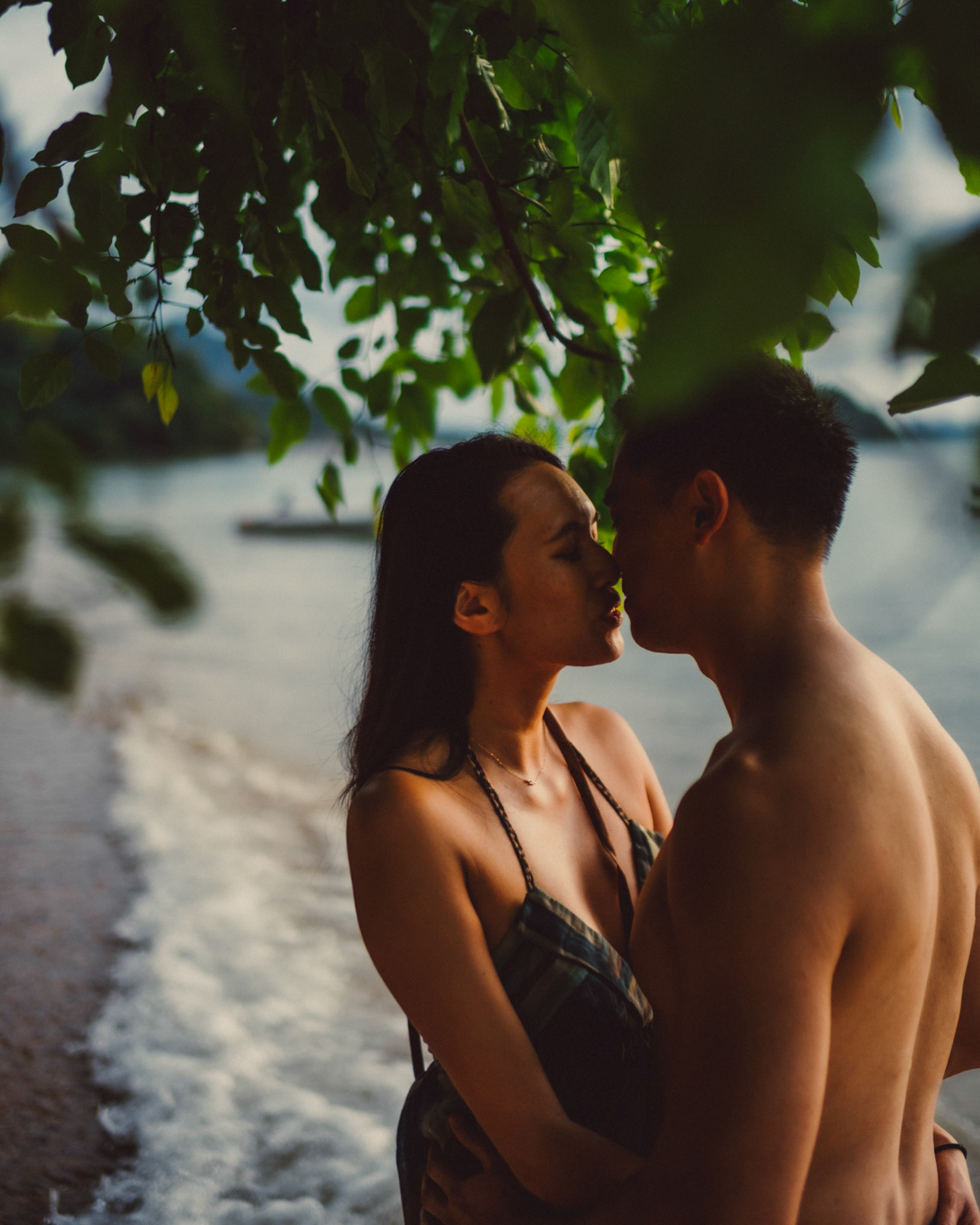 Intimate moments under a tree in front of Panorama Resort, from George and Allie's honeymoon portrait shoot in Corong-Corong Beach, El Nido, Palawan, Philippines, Southeast Asia, December 2018, Sony A7III