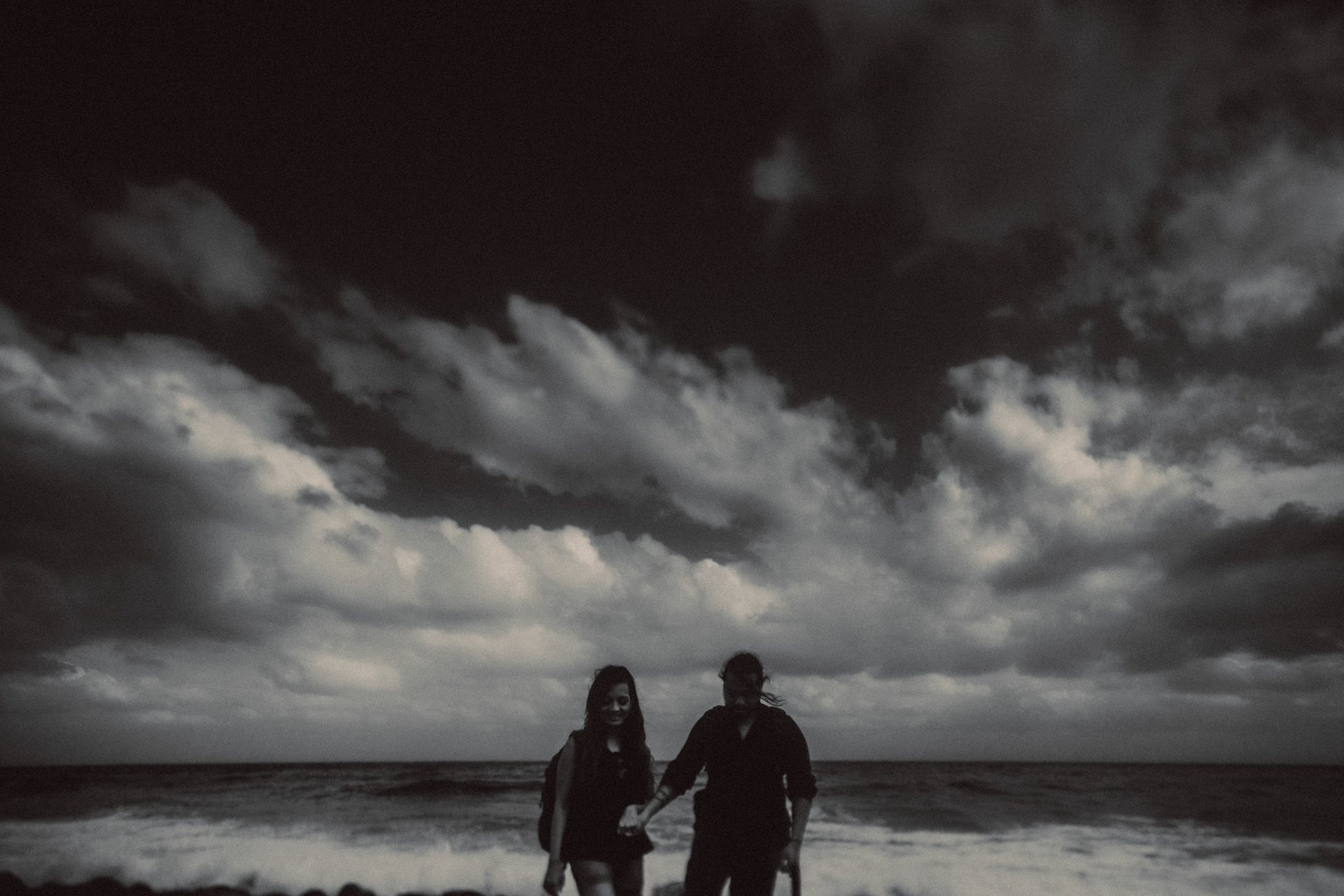 Moody adventure couple portraits in Valugan Boulder Beach, Basco, Batanes, Philippines, Southeast Asia, November 2014, Canon EOS 6D.