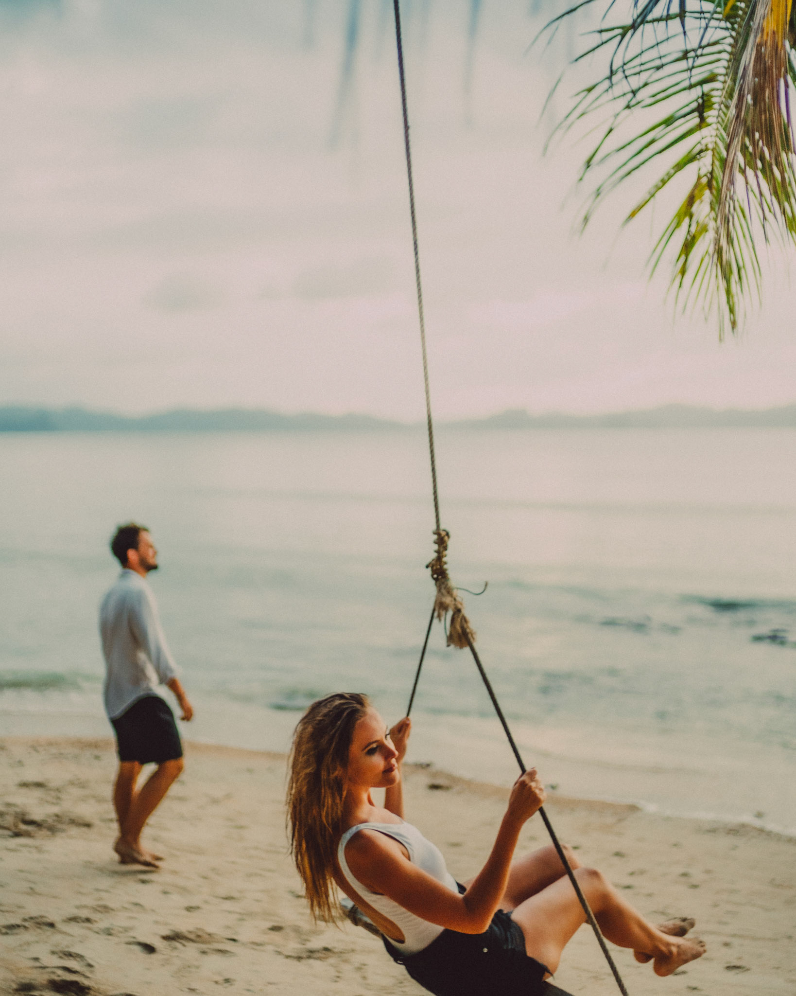 Blue hour couple portraits in Las Cabanas Beach, El Nido, Palawan, Philippines, Southeast Asia, December 2019, Sony A7III.