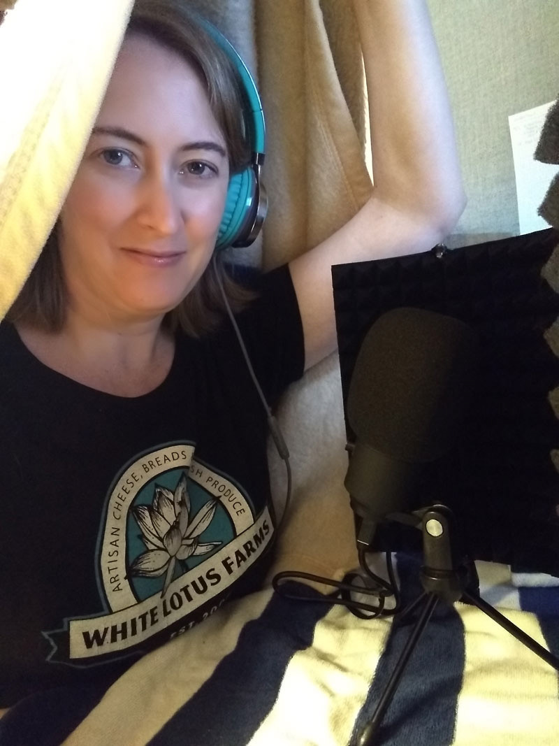 Karen at her desk recording her voice over