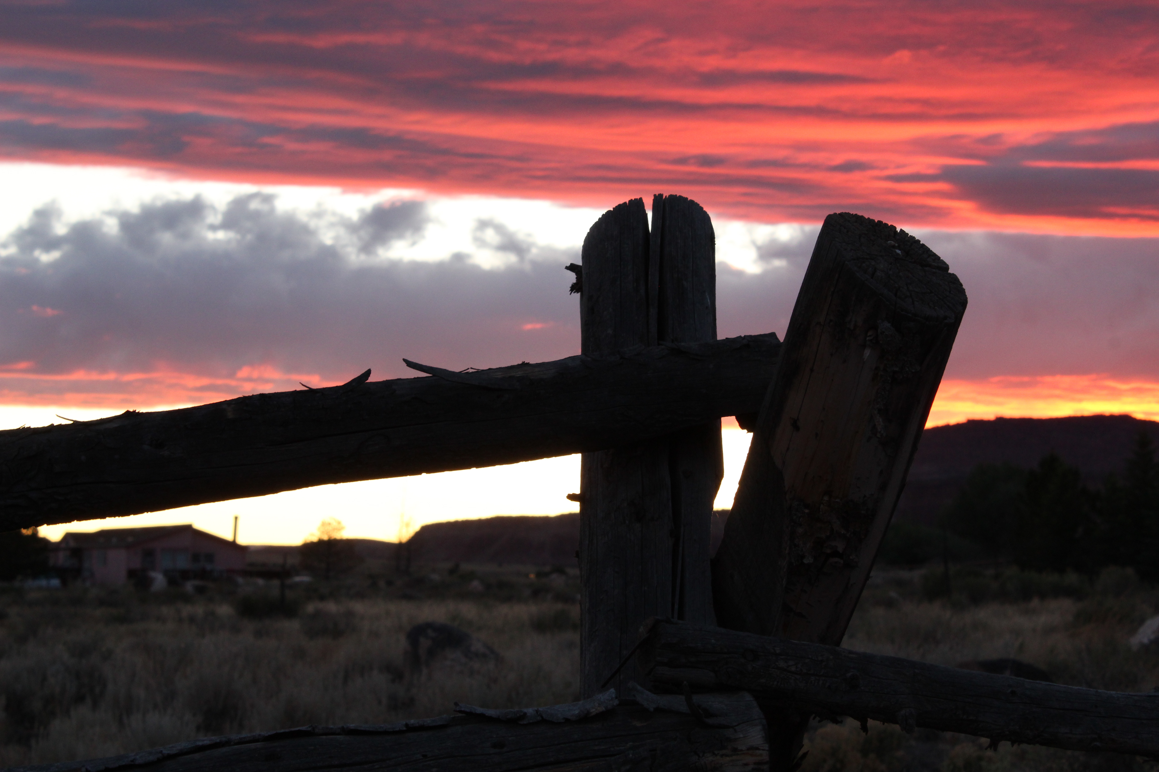 The sun sets on a fence in Capitol Reef NPS
