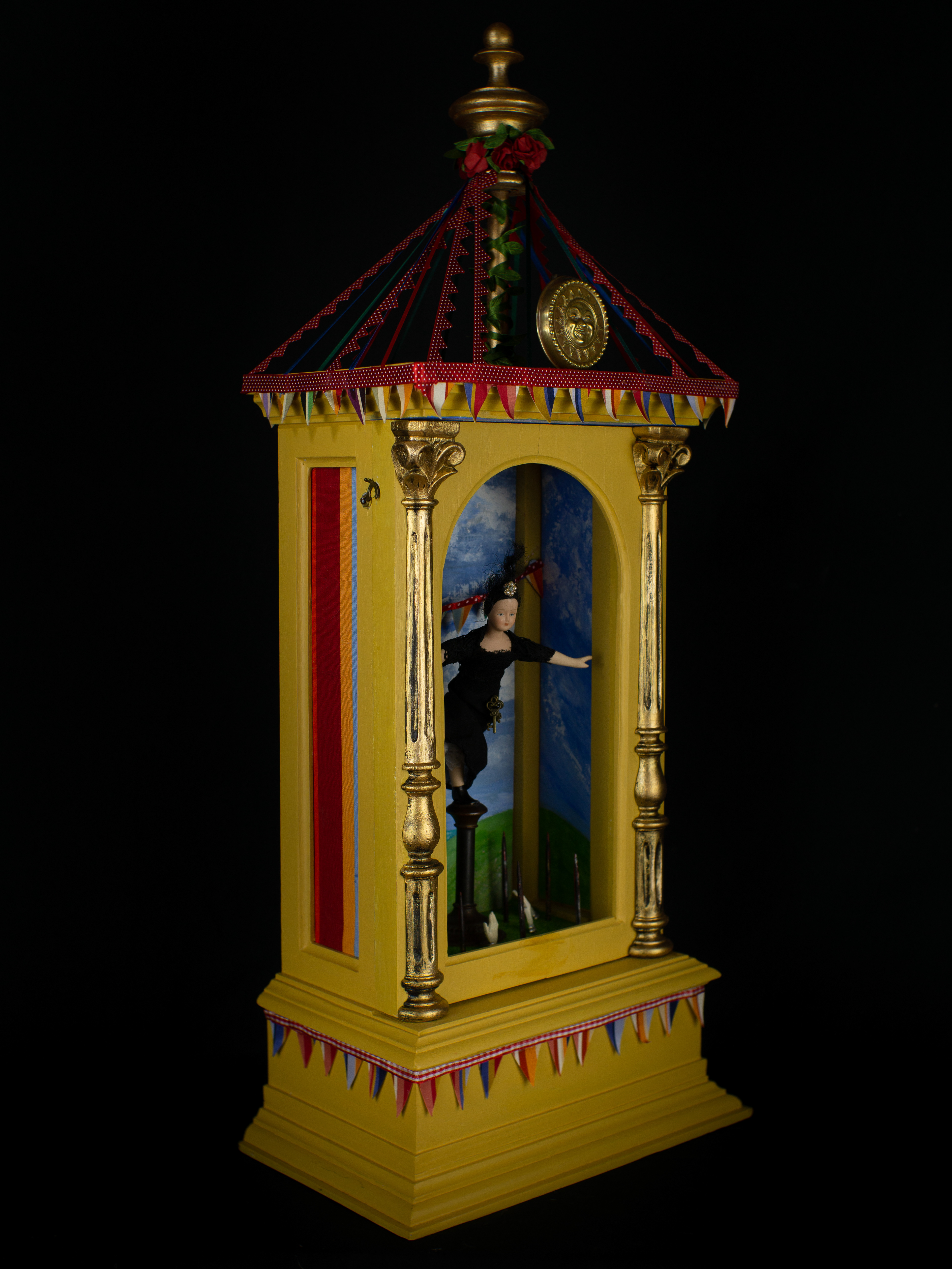 The Balancing Act - Refurbished antique wooden case, vintage miniature doll, brass, bronze and other metals, glass, paint, wood and textiles. 64 x 20 x 16