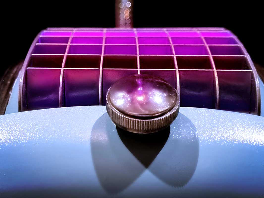 Magenta light glow from top grill
