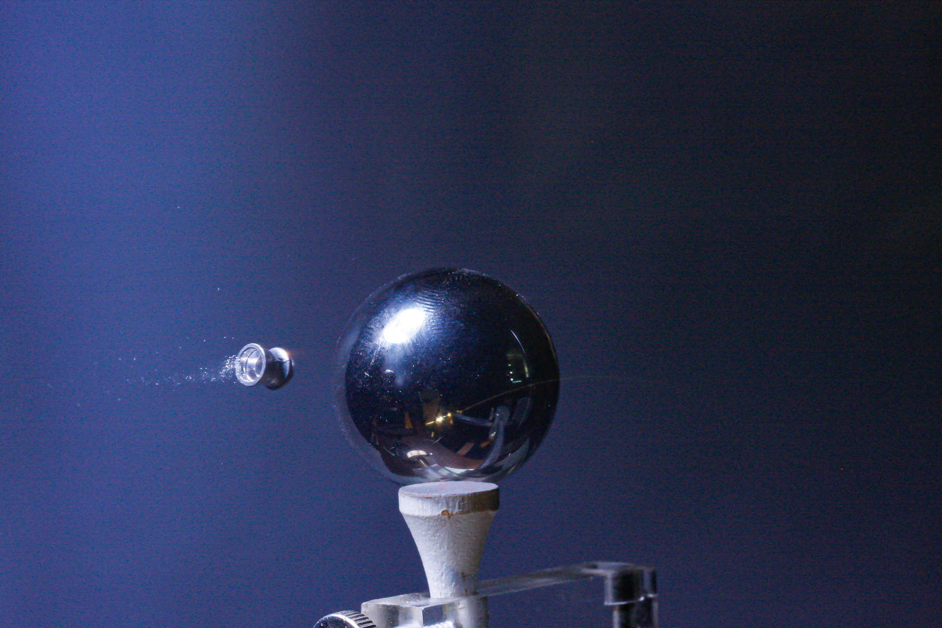 Air pistol pellet approaching steel ball on tee at about 450 fps