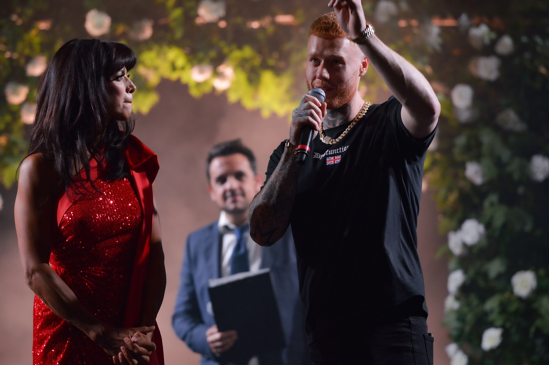 Jenny Powell on stage with Dysfunctionals founder and fashion designer at the 2019 Manchester Fashion Festival - runway photographer