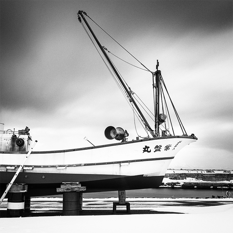 Long exposure photos of Japanese fishing boats.