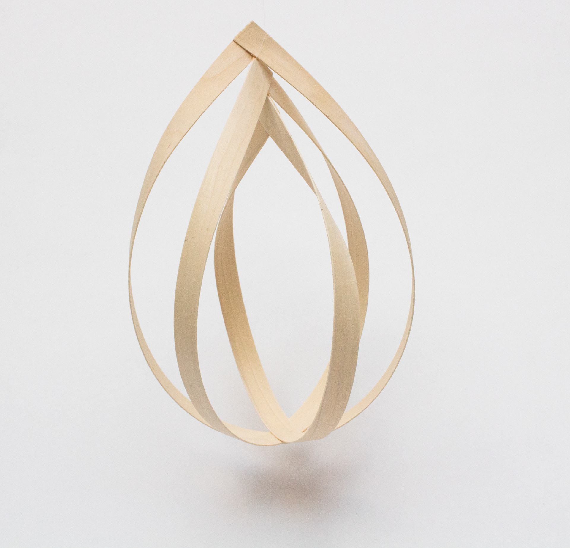 An exploration of volume and form giving through wood veneer strips.