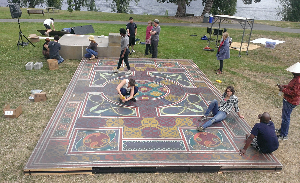 Setting up for the preview in the park Twelve decks make up the stage floor