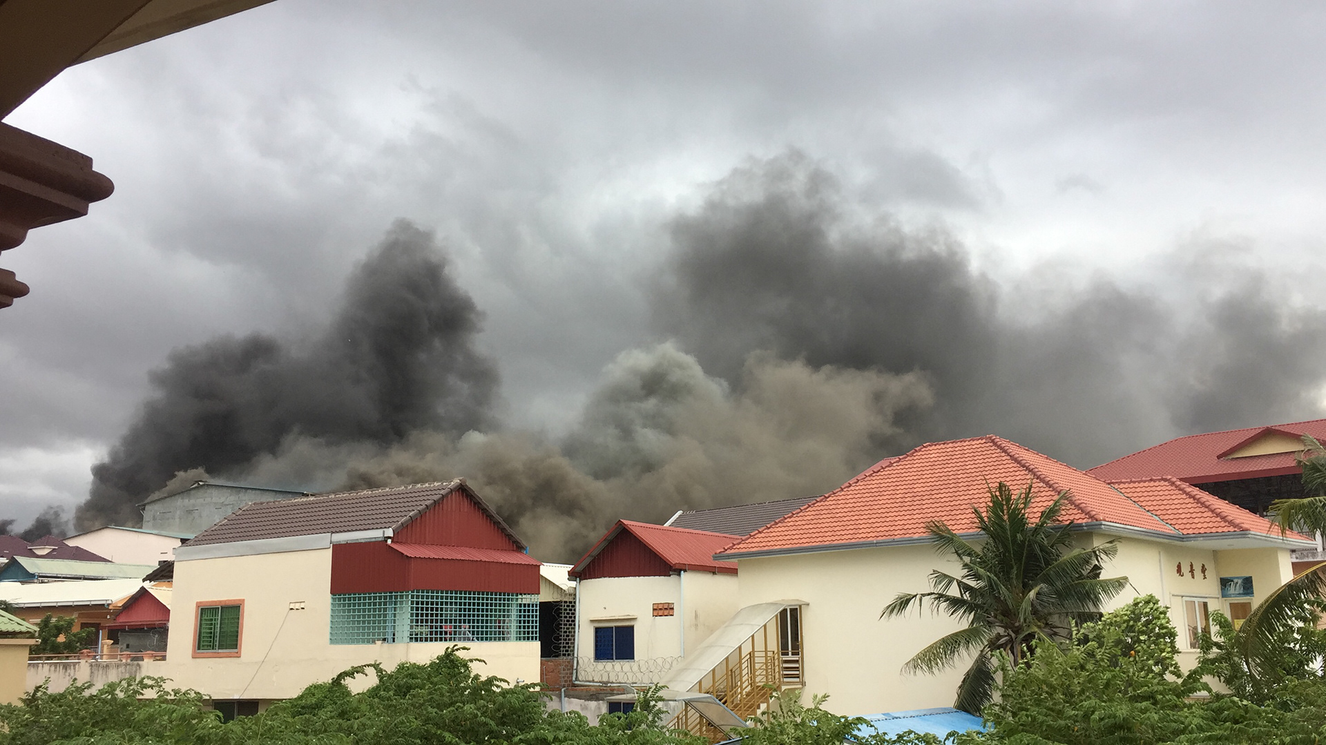 A fire at a local mattress factory. This view is from the balcony at Tonle.