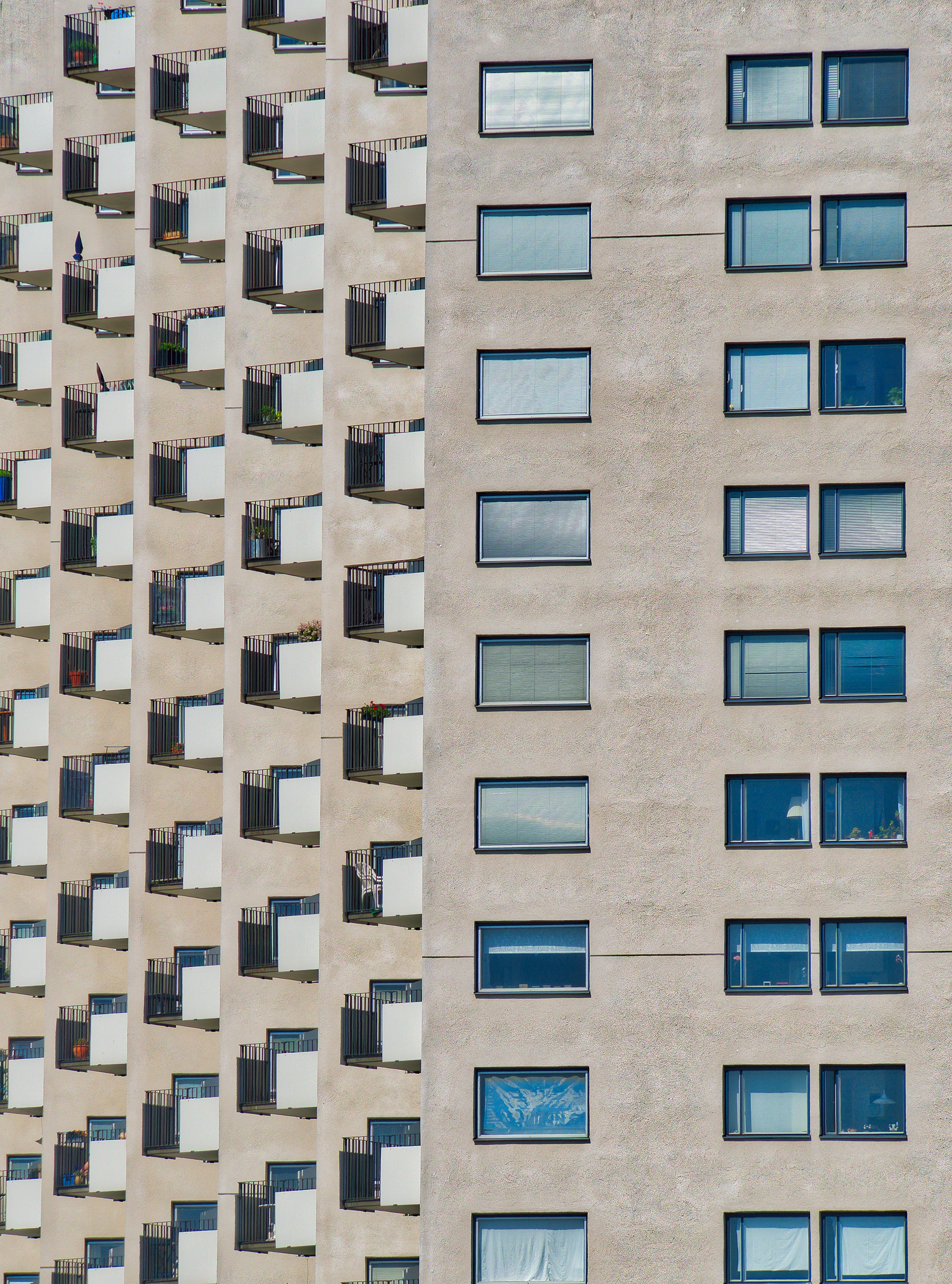Window facade and a row of balconies compressed together