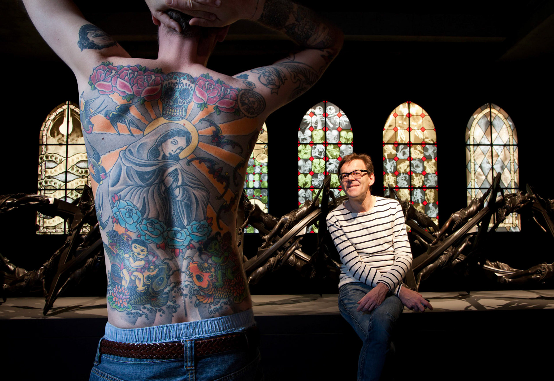 Wim Delvoye with his work, Tim, 2006 (Tattooed human skin), at MONA.                               2011