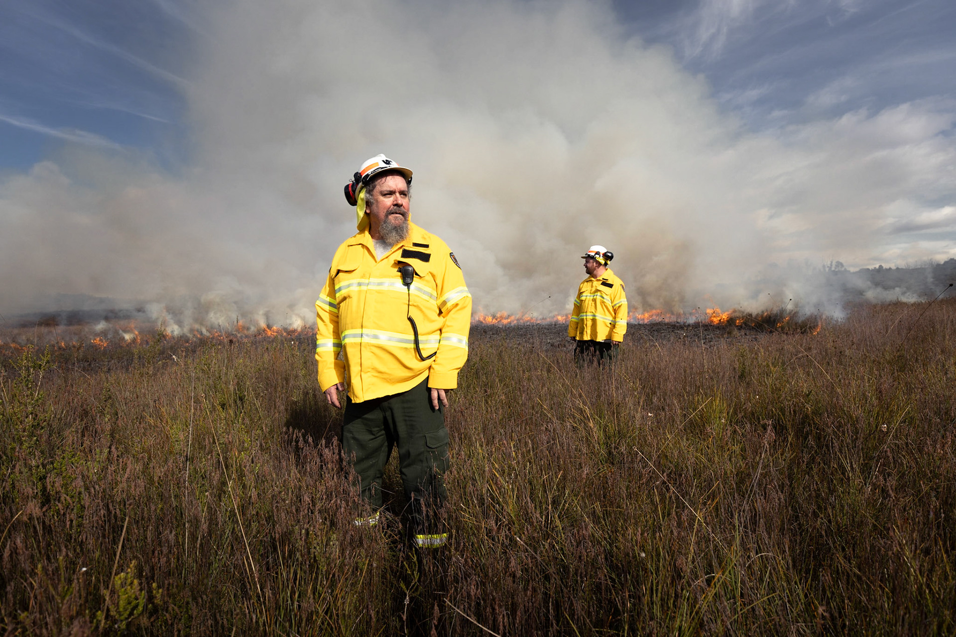 Tasmanian Parks and Wildlife Service program to re-introduce Aboriginal burning practices in the Tasmanian environment.Colin Hughes, with Josh Mansell, working on a burn at Dempster Plains in the North West of Tasmania.26/08/2021photo - Peter Mathew