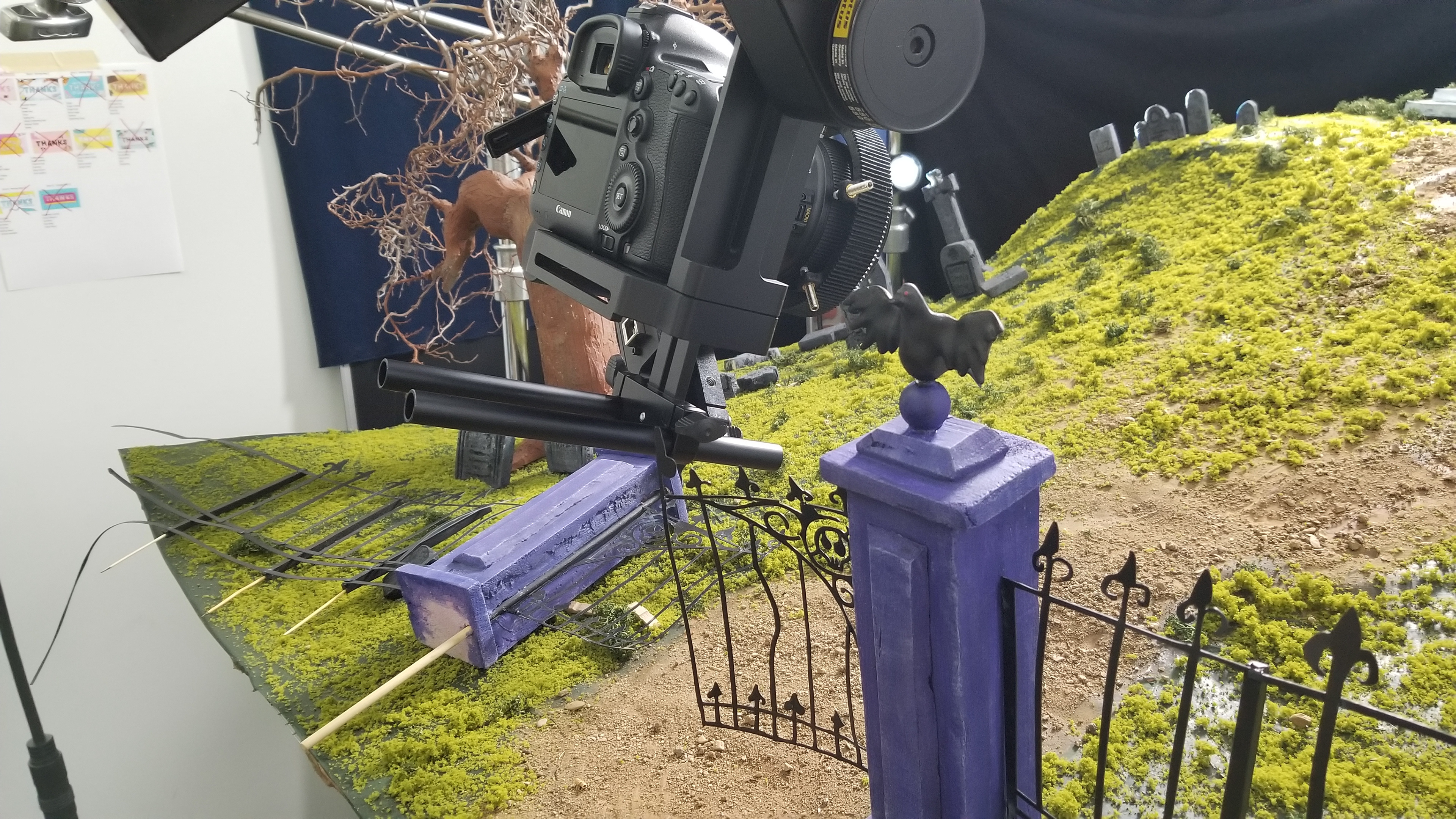 The gate opening in the beginning is a practical effect. The camera didn't quite fit through so the gate was made to move as it needed to.