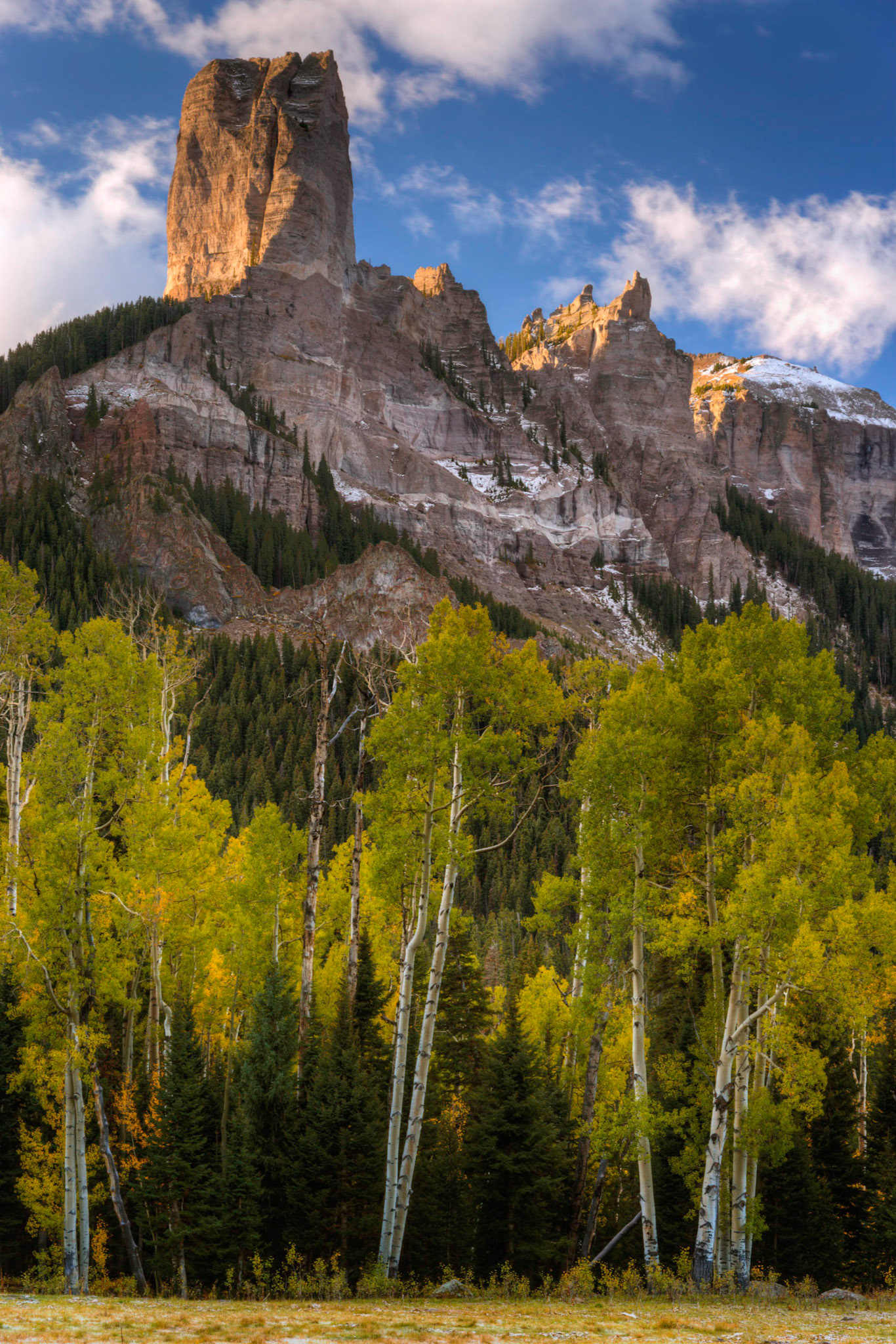 Chimney Rock, and Courthouse Mountain catching the early morning sunlight over the forests of autumn.Uncompahgre National ForestColoradoSeptember 29, 2017This is an HDR image consisting of 3 exposures merged in Photomatix Pro. Additional processing in Lightroom and Photoshop.PENTAX K-1, TAMRON 28-300mm F3.5-6.3 Ultra zoom XRISO 100 85 mm  0.5 sec at ƒ / 11