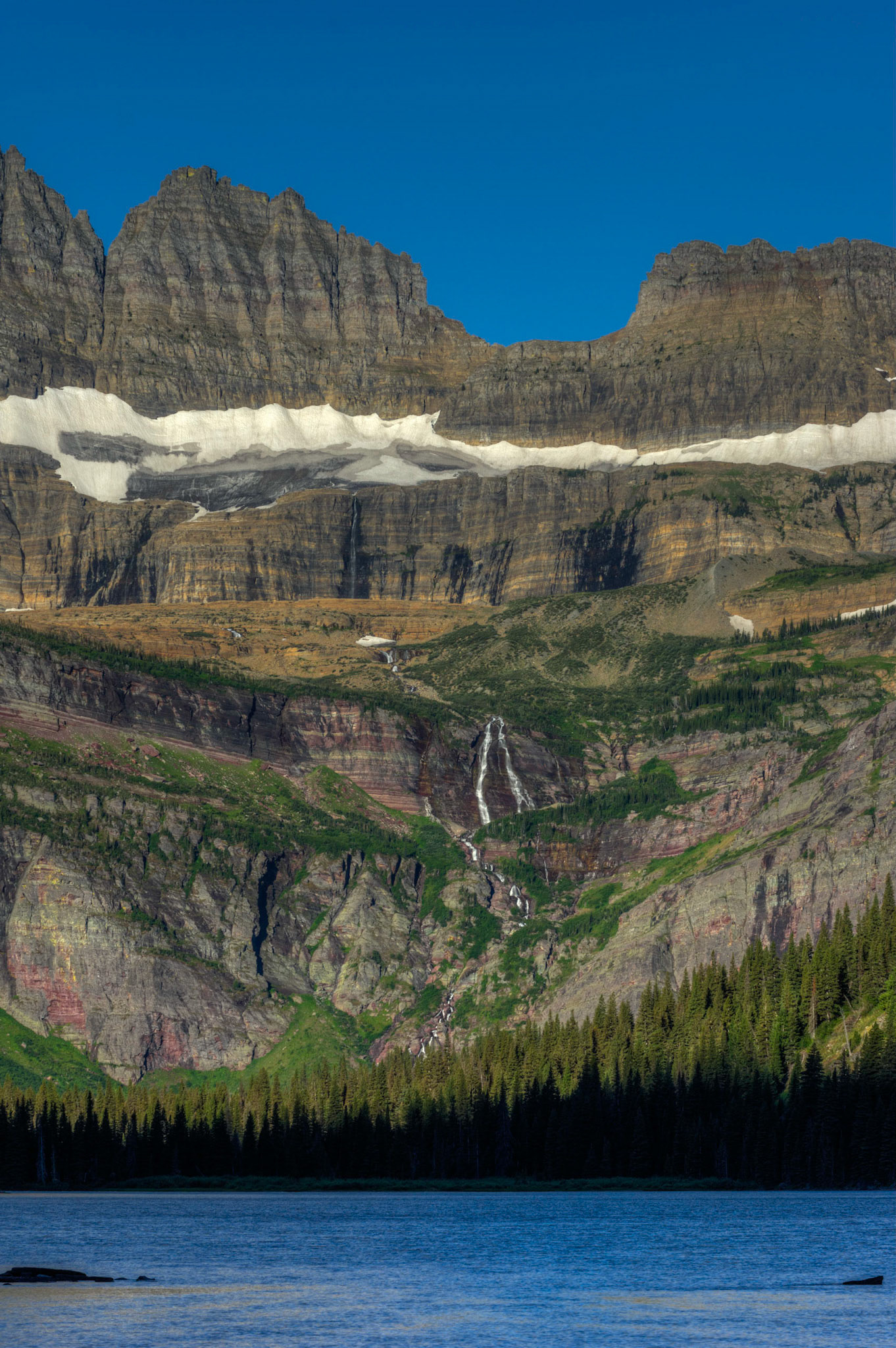 Salamander Glacier, Salamander Falls, and Grinnell Falls, on the way down to Lake Josephine.Glacier National ParkJuly 29, 2015This is an HDR image consisting of 5 exposures merged in Photomatix Pro. Additional processing in Lightroom and Photoshop.PENTAX K-3, Sigma 50-500mm f/4.5-6.3 APO DG OS HSM SLDISO 100 113 mm  ¹⁄₁₂₅ sec at ƒ / 11