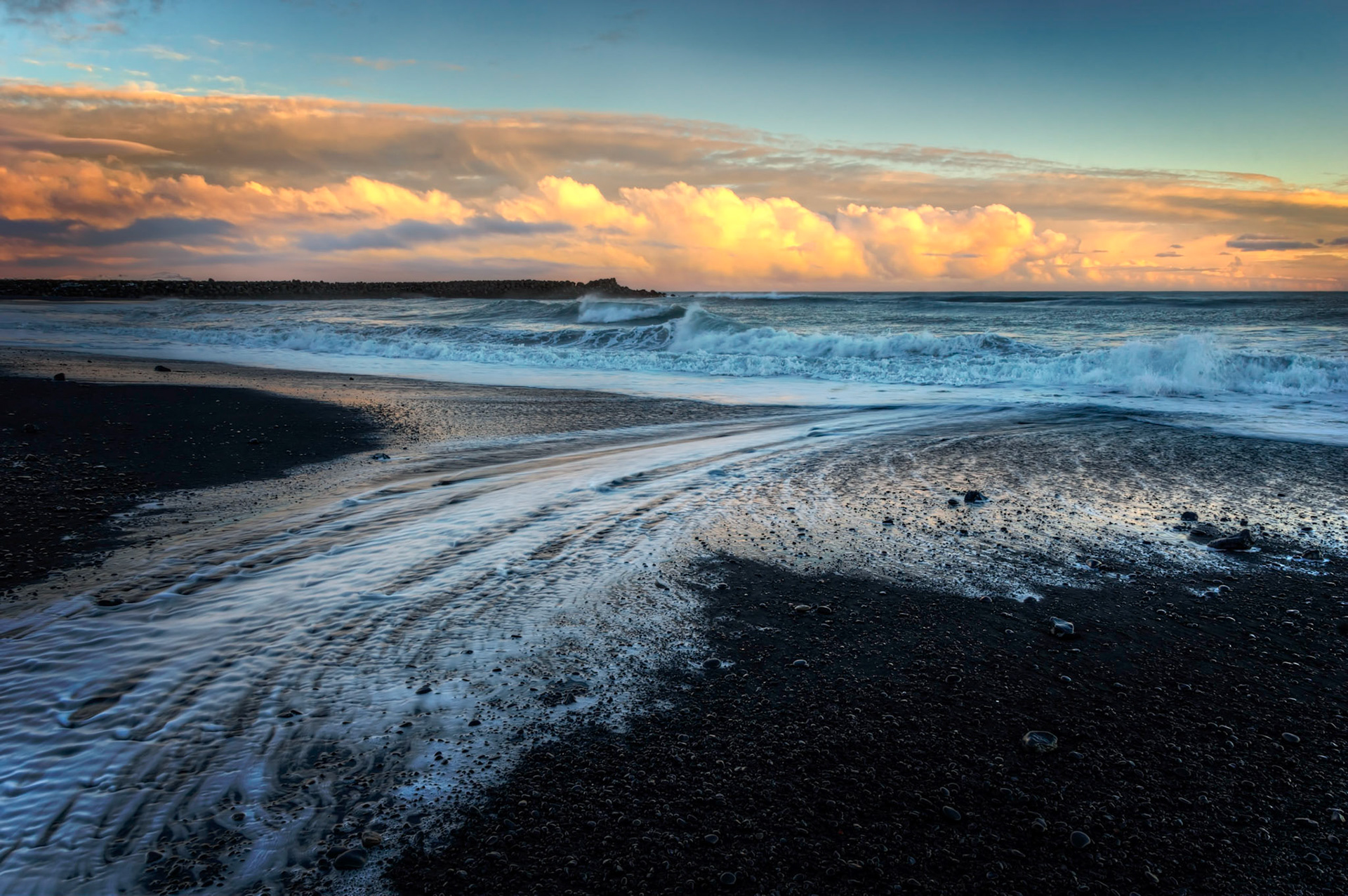Sunset at the black sand beach near Reynisdrangar.Vík, Suðerland, IcelandFebruary 11, 2016This is an HDR image consisting of 5 exposures merged in Photomatix Pro. Additional processing in Lightroom and Photoshop.PENTAX K-3, Sigma 18-250mm f/3.5-6.3 DC OS HSMISO 100 18 mm  ¹⁄₁₀ sec at ƒ / 14