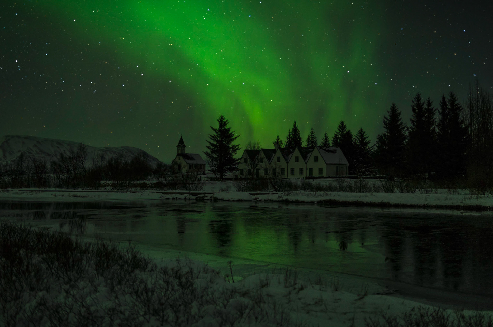 The northern lights over Þingvallakirkja.Þingvellir National ParkJanuary 31, 2016PENTAX K-3, Sigma 18-35mm f/1.8 DC HSM ArtISO 400 26 mm  15.0 sec at ƒ / 1.8