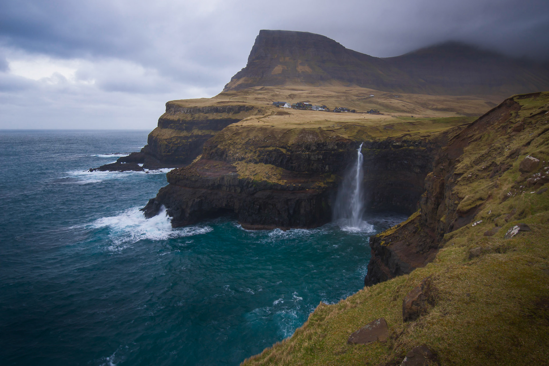 Mûlafossar, and the village of GasadalurVágar, Faroe IslandsMarch 27, 2019Pentax K-1, HD PENTAX-D FA 15-30mm F2.8ED SDM WRISO 100 21 mm  ¹⁄₁₀ sec at ƒ / 18