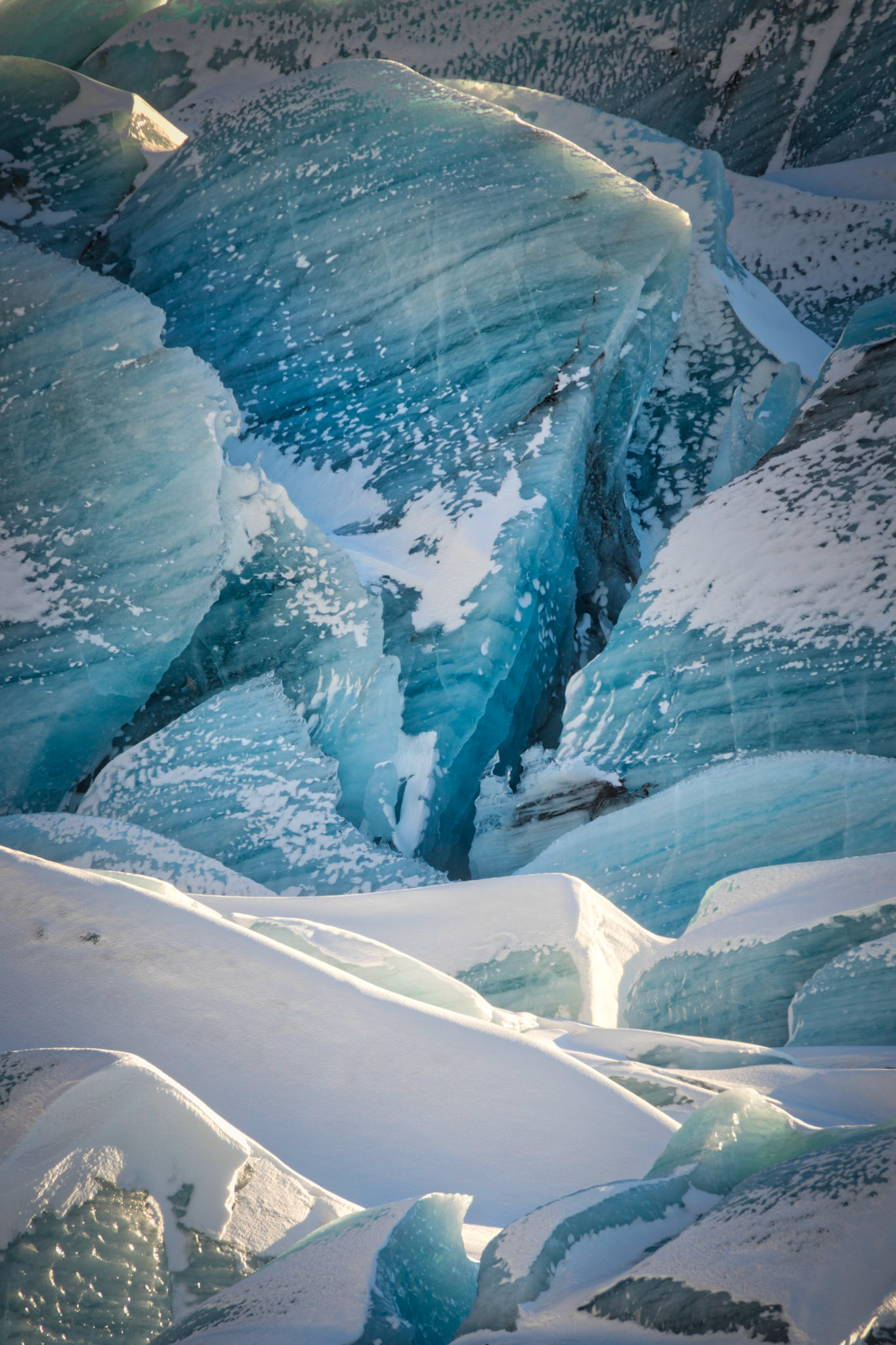 Part of the icefield at Svínafellsjökull, one of thirty glacial tongues of the Vatnajökull glacier.VatnajökulsþjóðgarðurAusturland, IcelandFebruary 9, 2016PENTAX K-3, Sigma 18-250mm f/3.5-6.3 DC OS HSMISO 100 210 mm  ¹⁄₁₅ sec at ƒ / 11
