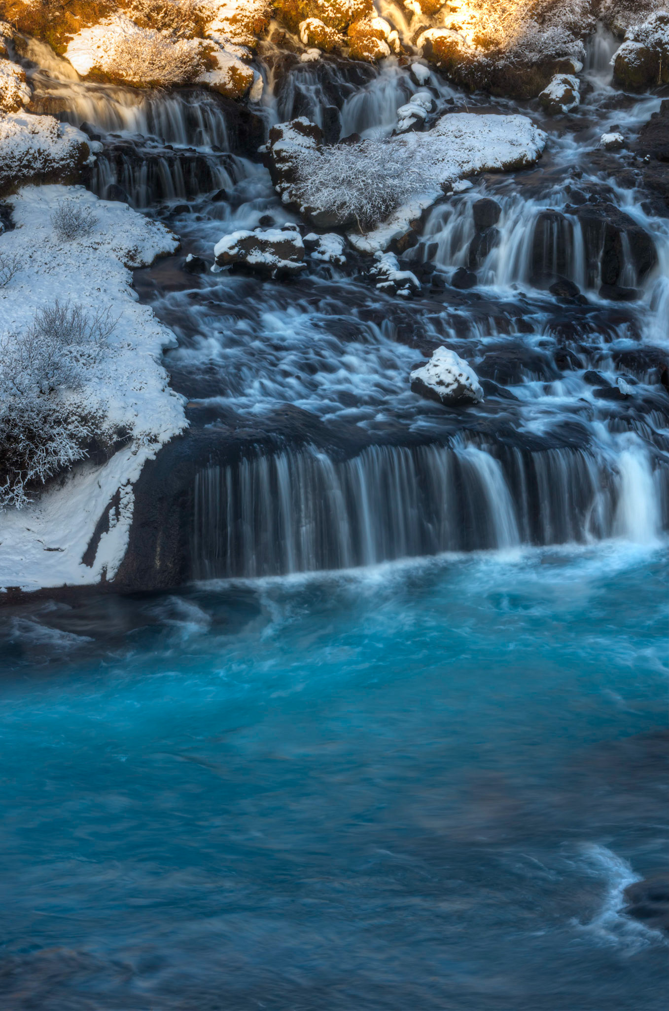 Hraunfossar, where snowmelt filtering through the lavafields above flow down into the Hvitá River.Vesturland, IcelandFebruary 5, 2016This is an HDR image consisting of 5 exposures merged in Photomatix Pro. Additional processing in Lightroom and Photoshop.PENTAX K-3, Sigma 18-250mm f/3.5-6.3 DC OS HSMISO 100 53 mm  0.3 sec at ƒ / 16