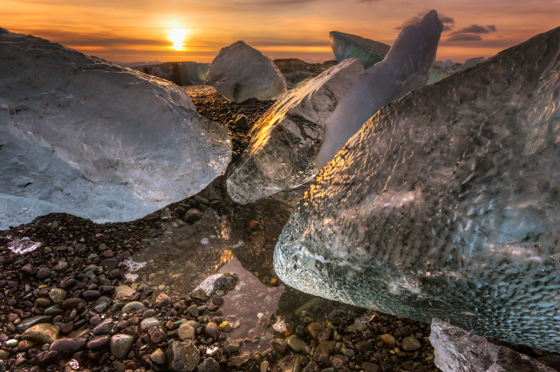 Sunrise at the ice beach at the outlet of Jökullsárlón.Austurland, IcelandFebruary 2, 2016This is an HDR image consisting of 5 exposures merged in Photomatix Pro. Additional processing in Lightroom and Photoshop.PENTAX K-3, Sigma 10-20mm f/4-5.6 EX DCISO 100 13 mm  ⅛ sec at ƒ / 18