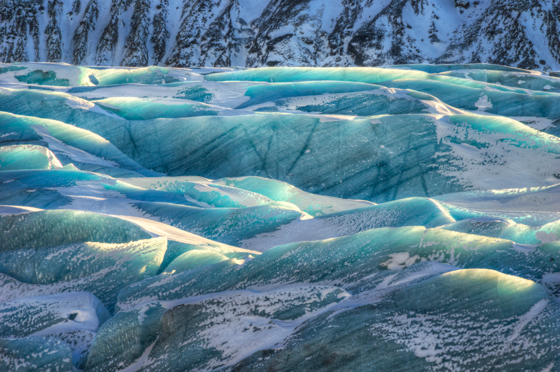 Part of the icefield at Svínafellsjökull, one of thirty glacial tongues of the Vatnajökull glacier.VatnajökulsþjóðgarðurFebruary 9, 2016This is an HDR image consisting of 5 exposures merged in Photomatix Pro. Additional processing in Lightroom and Photoshop.PENTAX K-3, Sigma 18-250mm f/3.5-6.3 DC OS HSMISO 100 250 mm  ¹⁄₁₀ sec at ƒ / 18