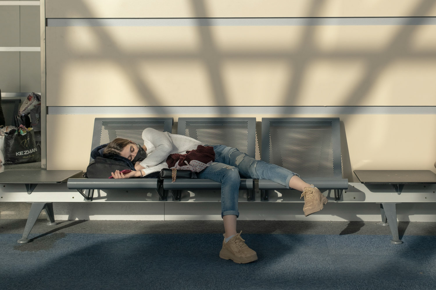 People who wait for their Istanbul flight in Tbilisi Airport in Georgian