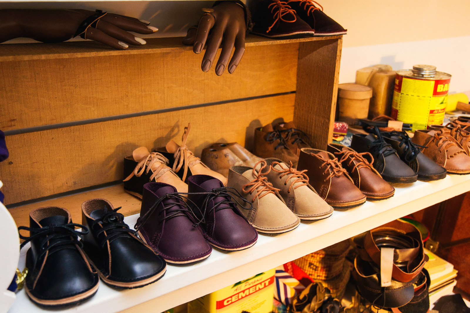Baby shoes in a line, handmade leather shoes by Ty Nelson