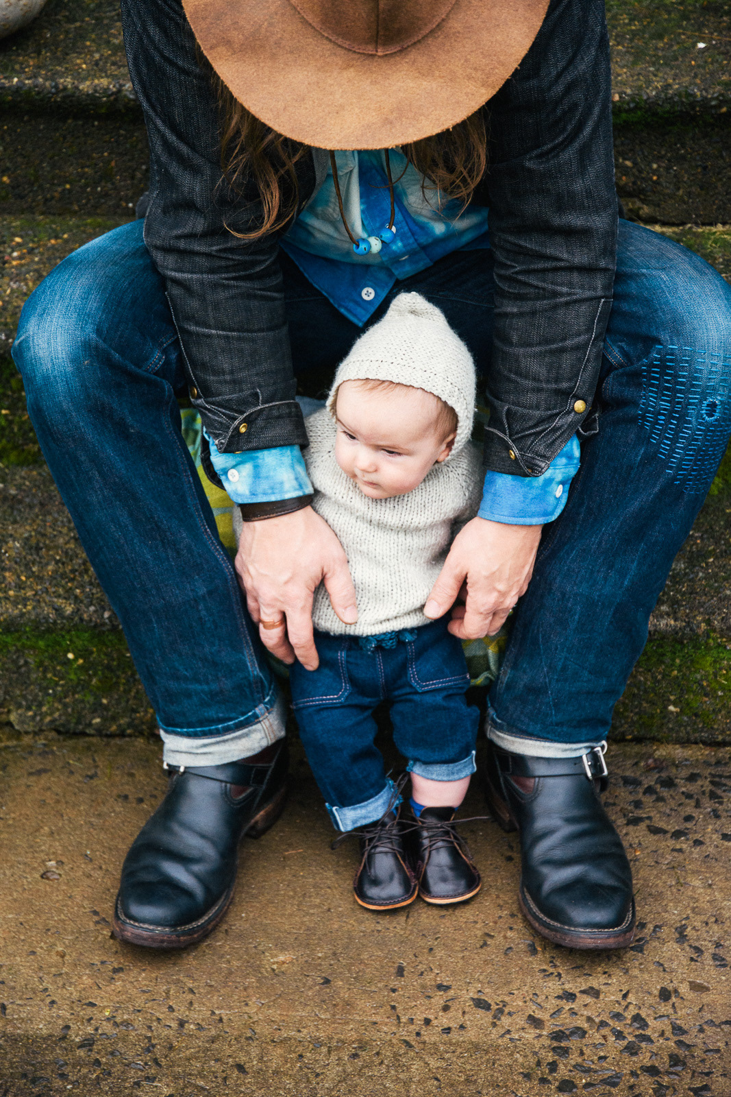 Ty Nelson of Frank Lee Fine Leathers shows his handmade baby shoes on his son