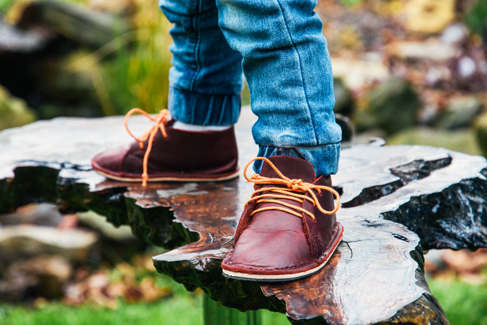 Close-up product photo of child wearing leather shoes