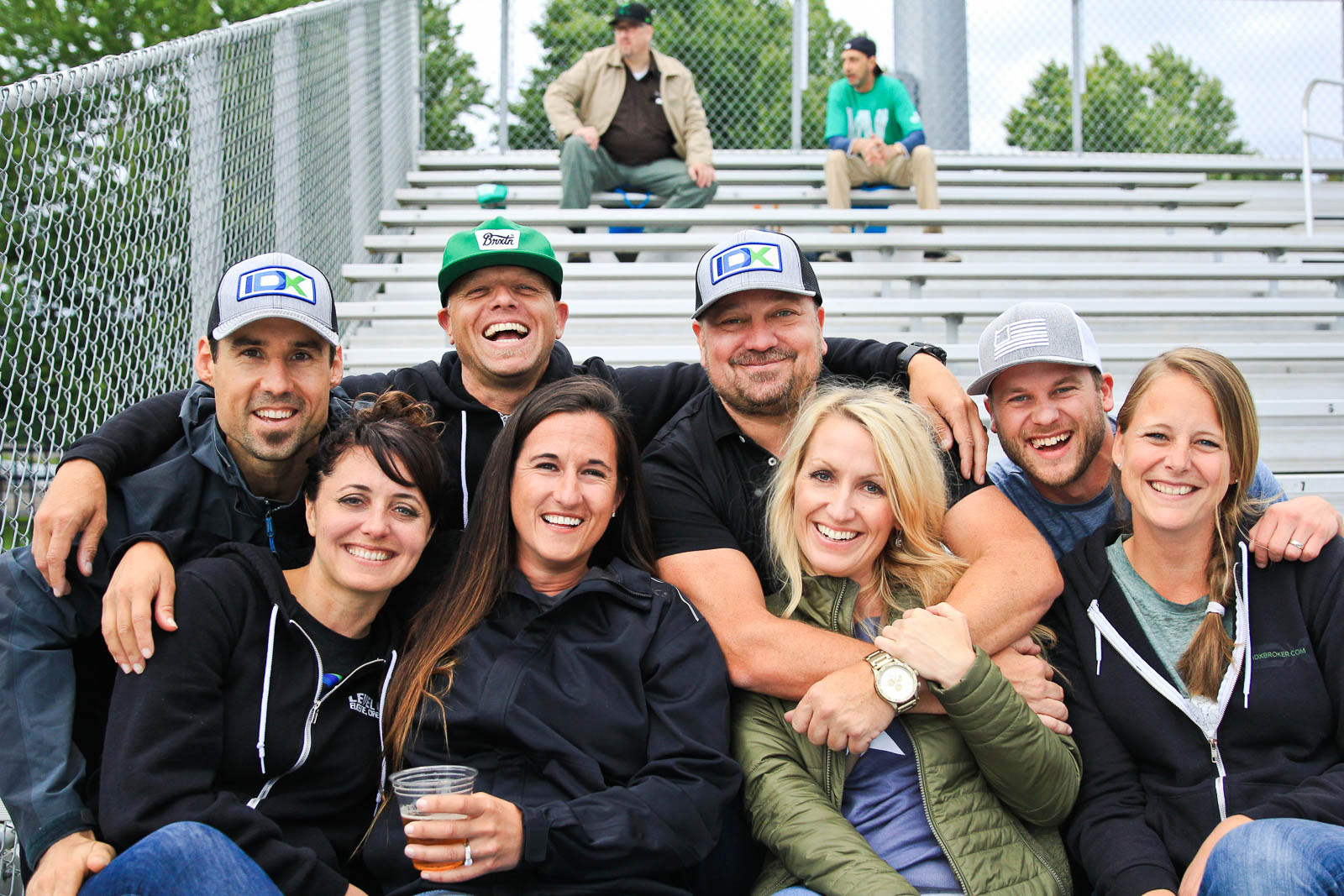 IDX team posing for group photo at a Eugene Emeralds baseball game