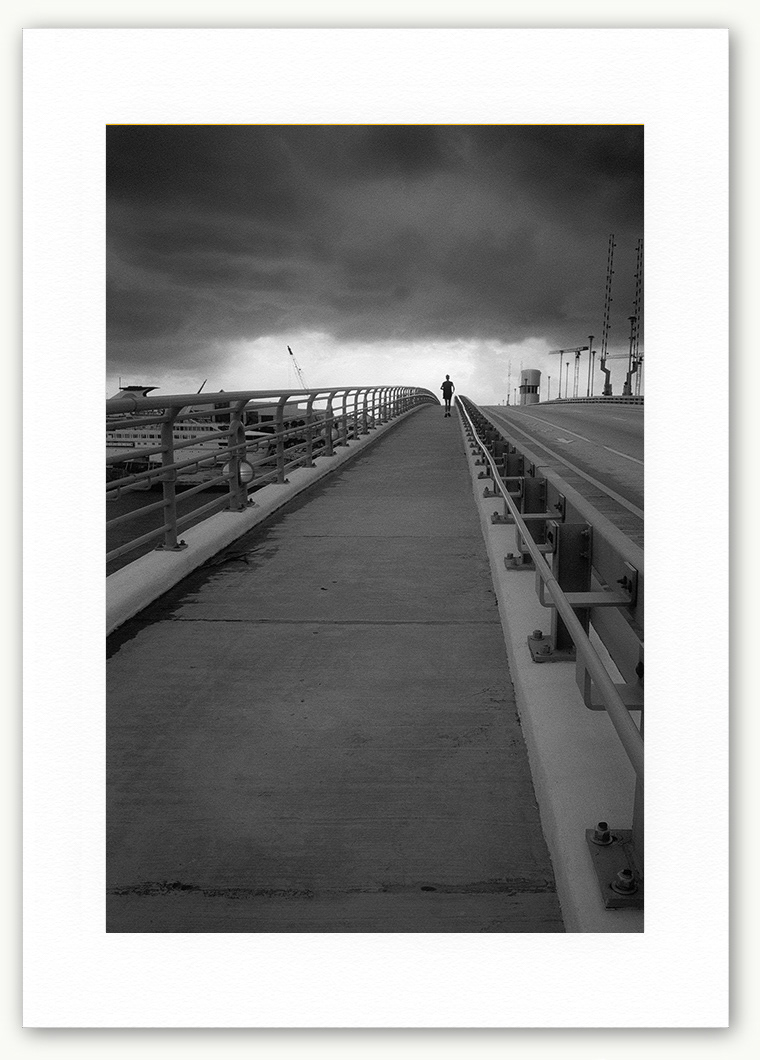 Steve Hanson Photography Jogger & storm, Ft. Lauderdale, Florida, USA.