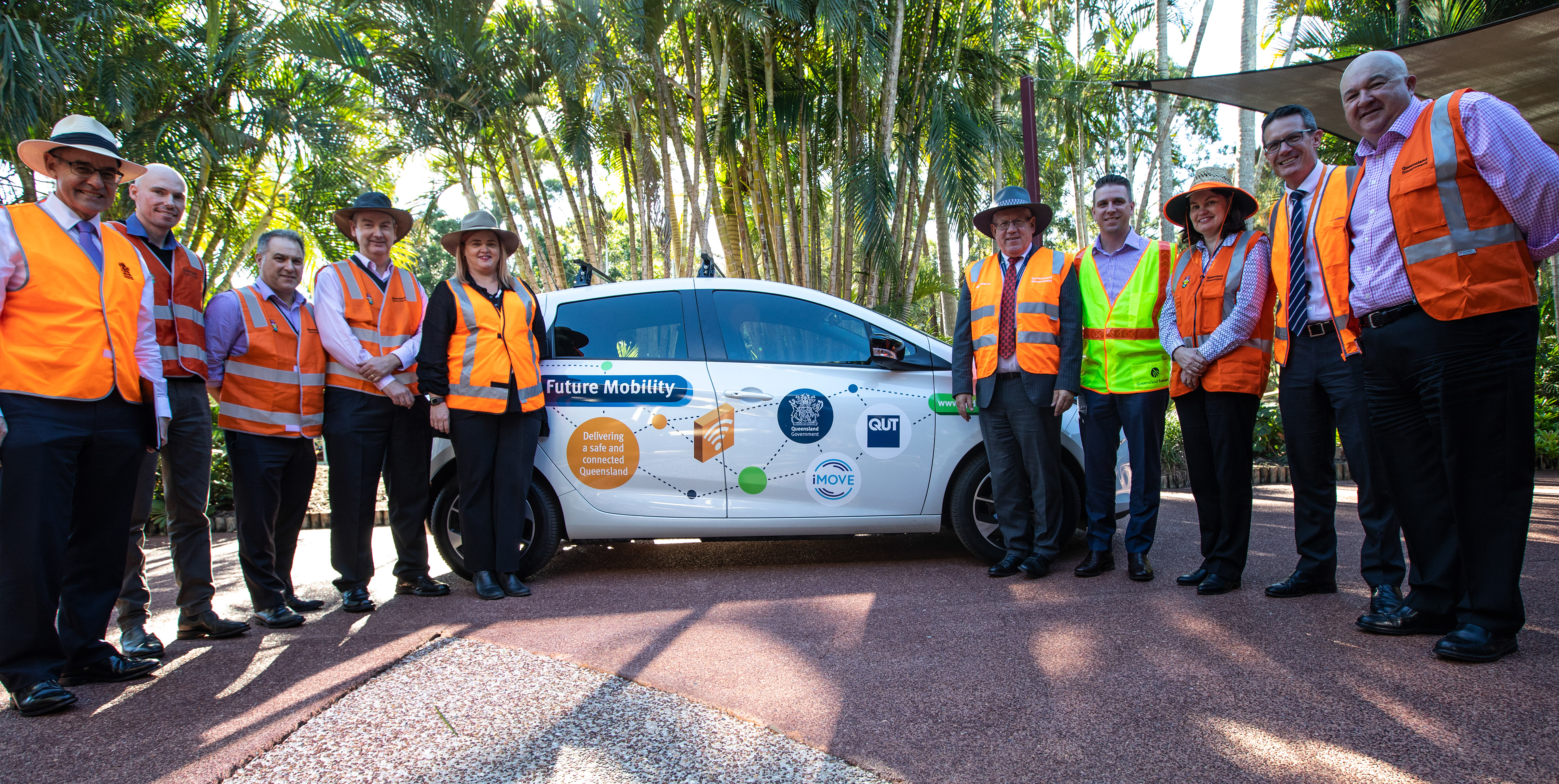 Group photograph surrounding the departments test vehicle